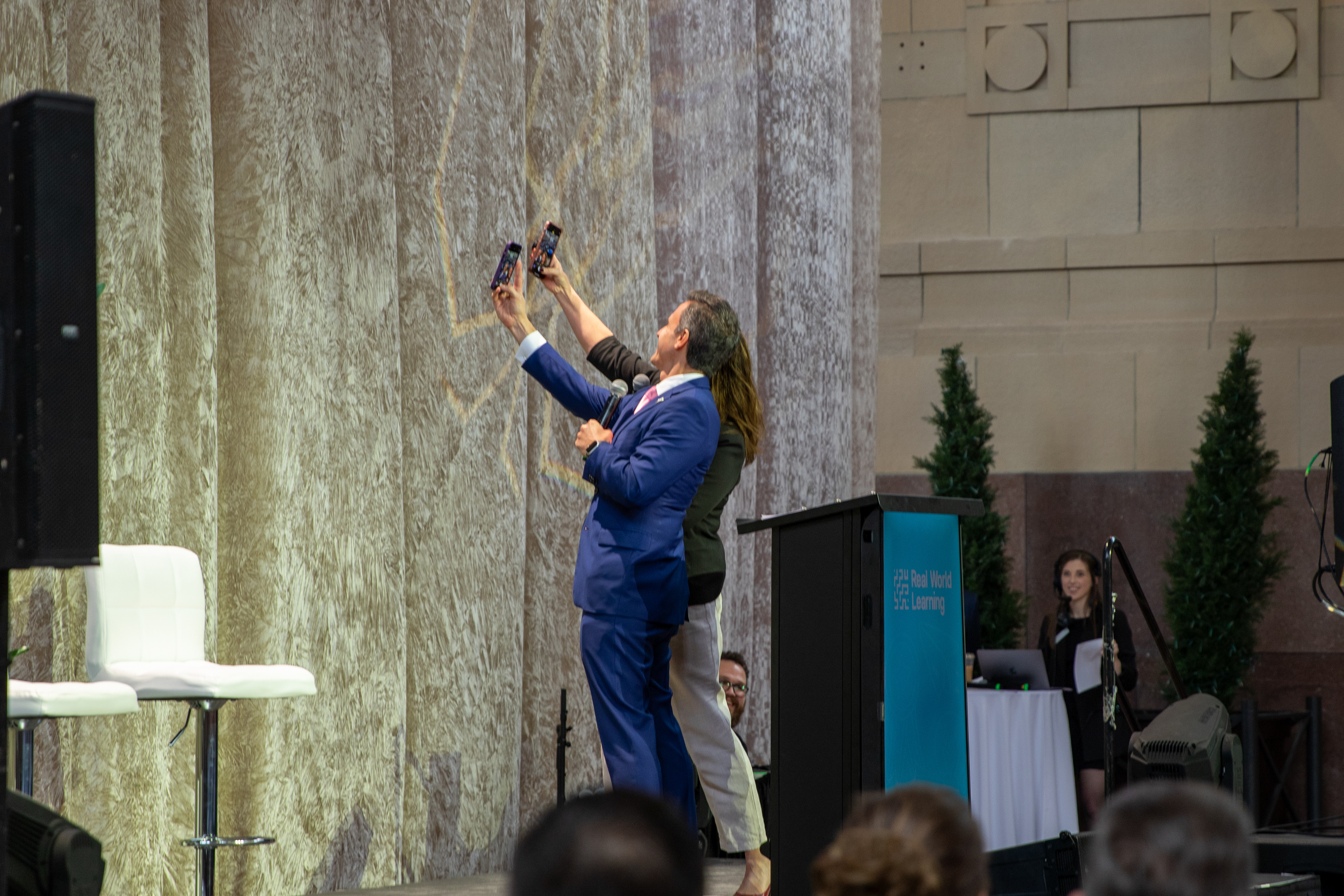 Dr. Kenny Rodrequez, the Missouri Superintendent of the Year from Grandview School District, and Dr. Michelle Hubbard, the Kansas Superintendent of the Year from Shawnee Mission School District take advantage of their on-stage opportunity to snap an off-script selfie with the Get on the Bus crowd of over 500 guests. 