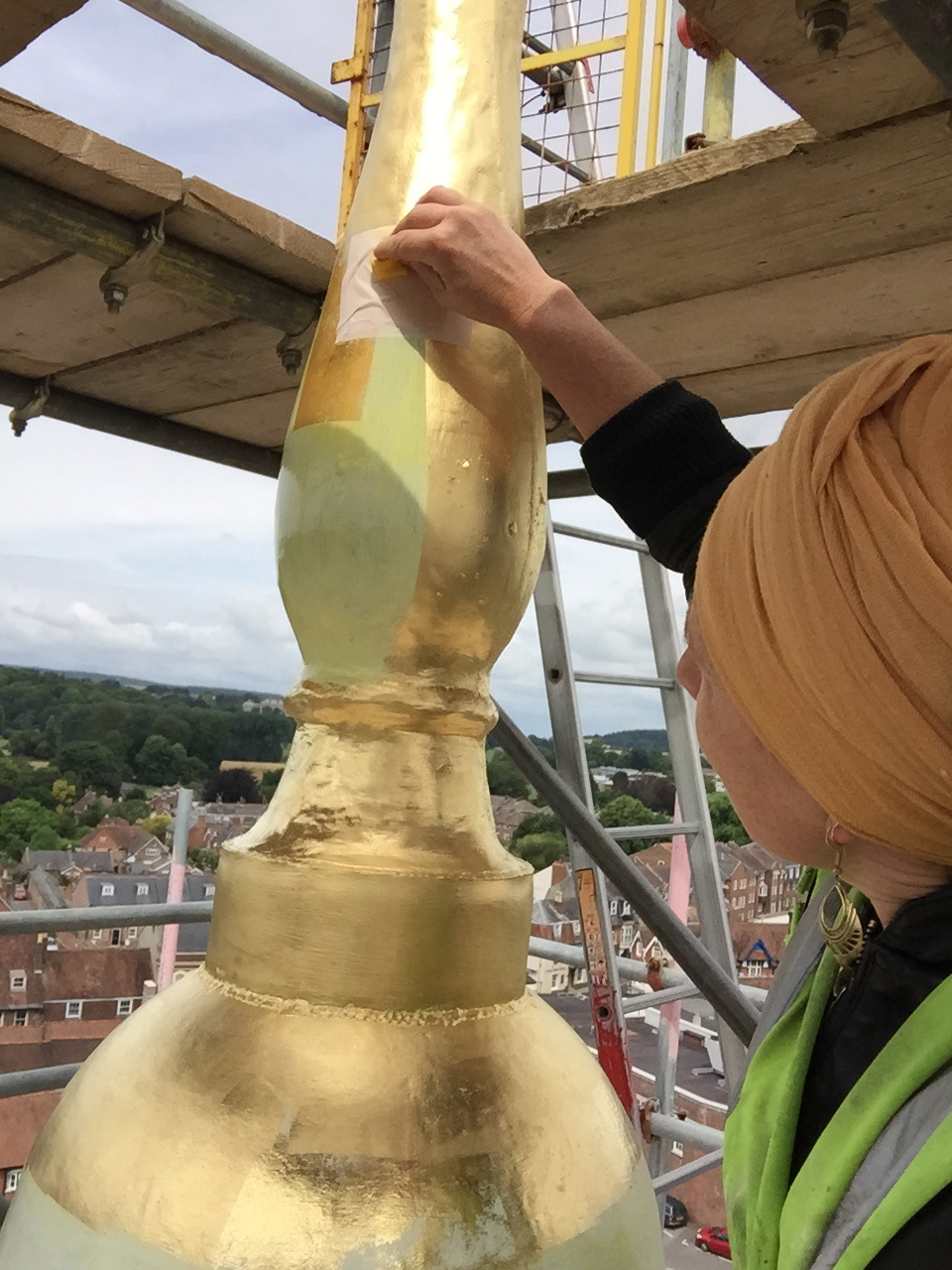 Gilding the windvane on the church at Blandford forum