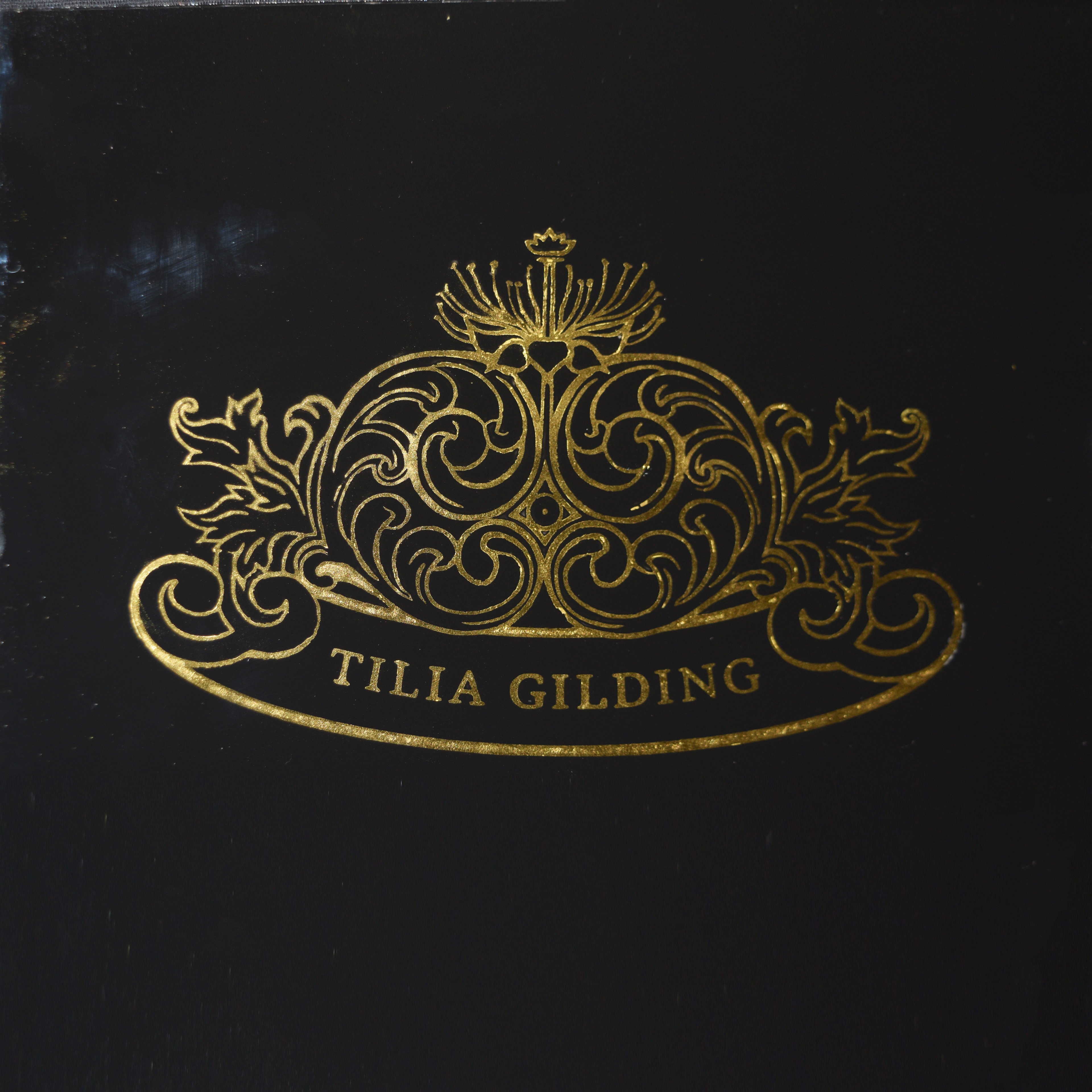 Tilia Gilding logo - 23.5ct gold on glass
