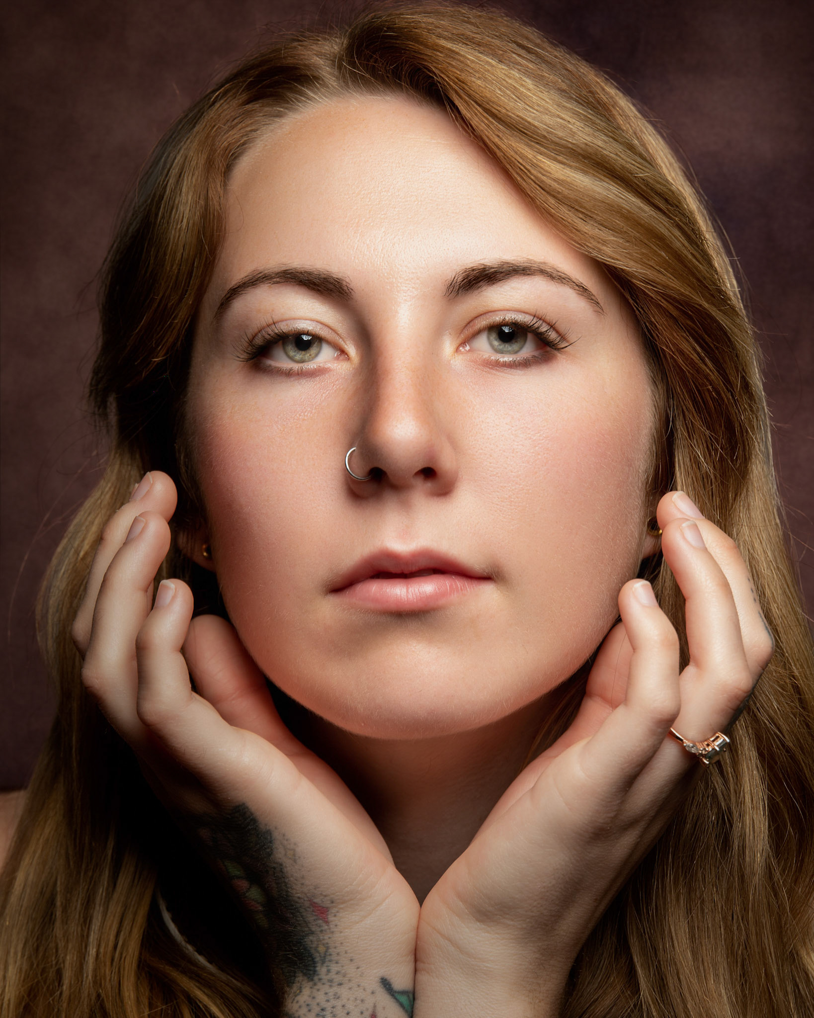 A strawberry beauty, her captivating allure lies in the unique blend of elegance and fiery softness.