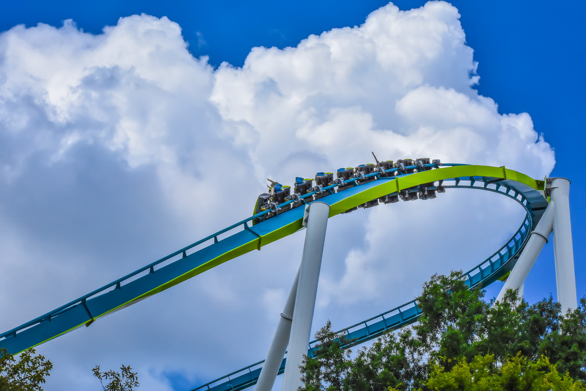 Fury 325 cruises around in front of a massive cloud.