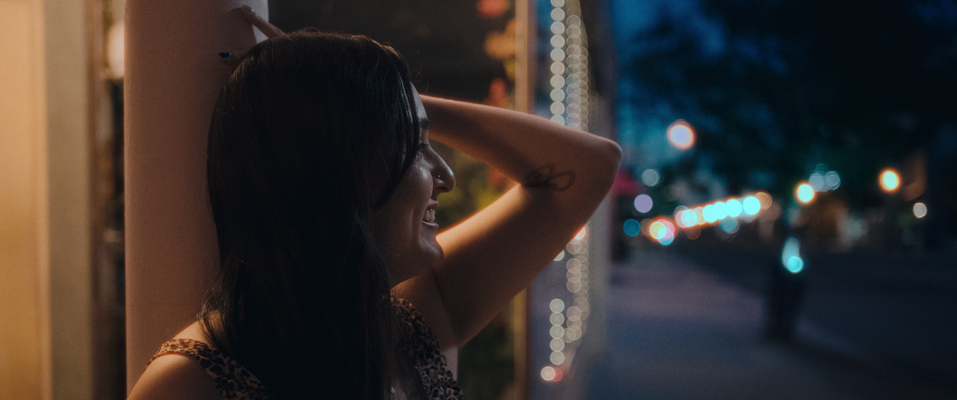 A quiet cinematic moment near the café lights downtown