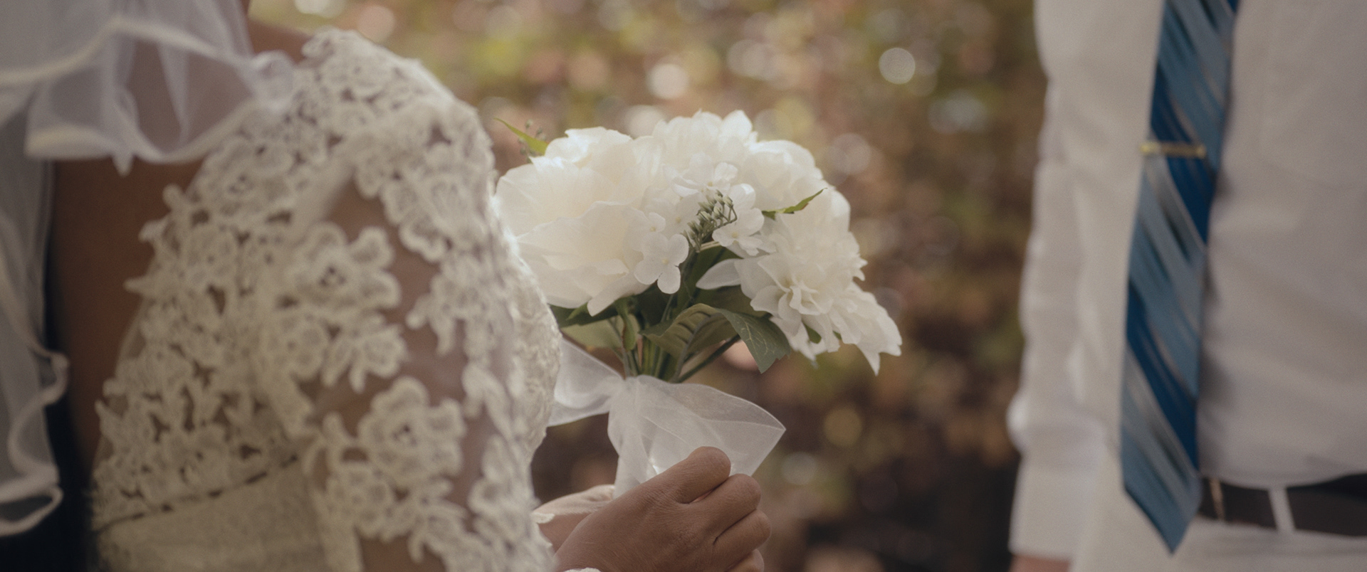 White peony wedding bouquet detail captured during an outdoor ceremony in Pocatello, Idaho.