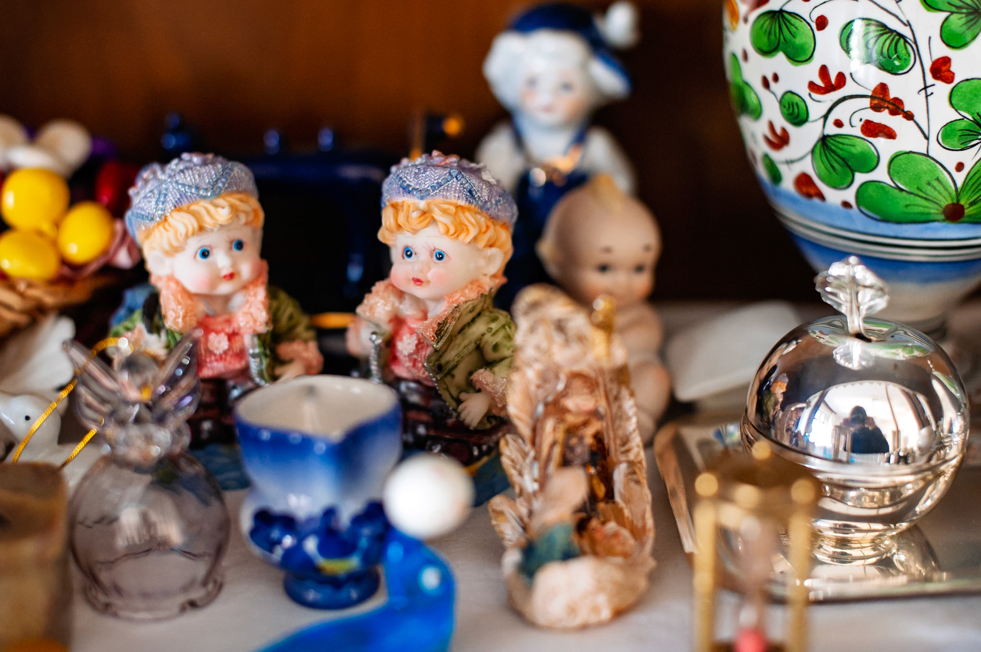 Small knick-knacks on display in Nonna's living room.  You can see my reflection in the silver bauble. 