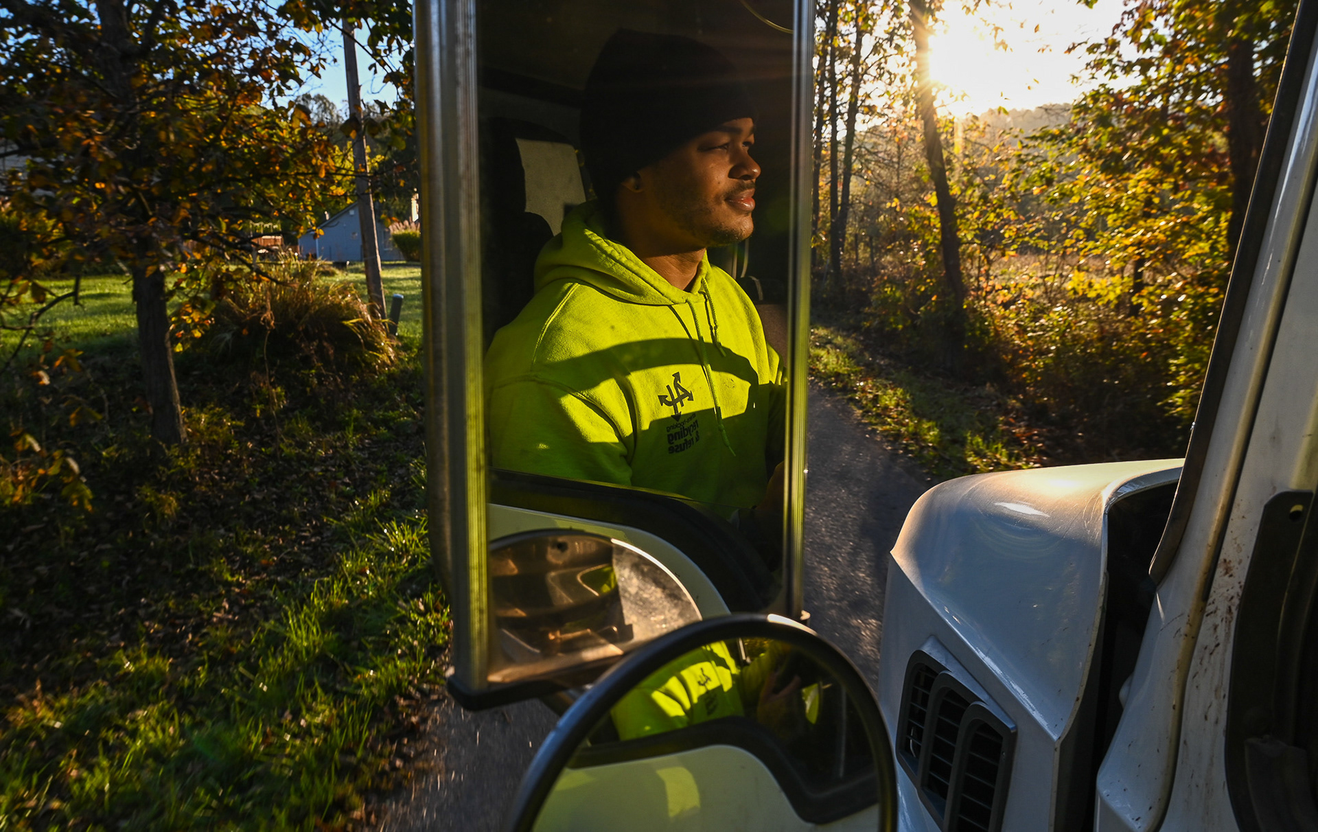 Amadaz Jones drives his morning recycling route for Athens-Hocking Recycling Center in The Plains, Ohio, on Thursday, October 10, 2024. Athens-Hocking Recycling Center, a 501(c)(3) nonprofit organization, is dedicated to collecting and processing recyclable materials across southeast Ohio to foster a cleaner, safer, and more sustainable community. A pioneer in recycling, AHRC launched Ohio’s first curbside recycling program in 1984 and continues to promote recycling in communities throughout southeast Ohio. “We pick up residential cans on Monday and Thursday,” said Jones. “Then we’re on campus during the weekend, too, helping keep the place clean and making rounds.”