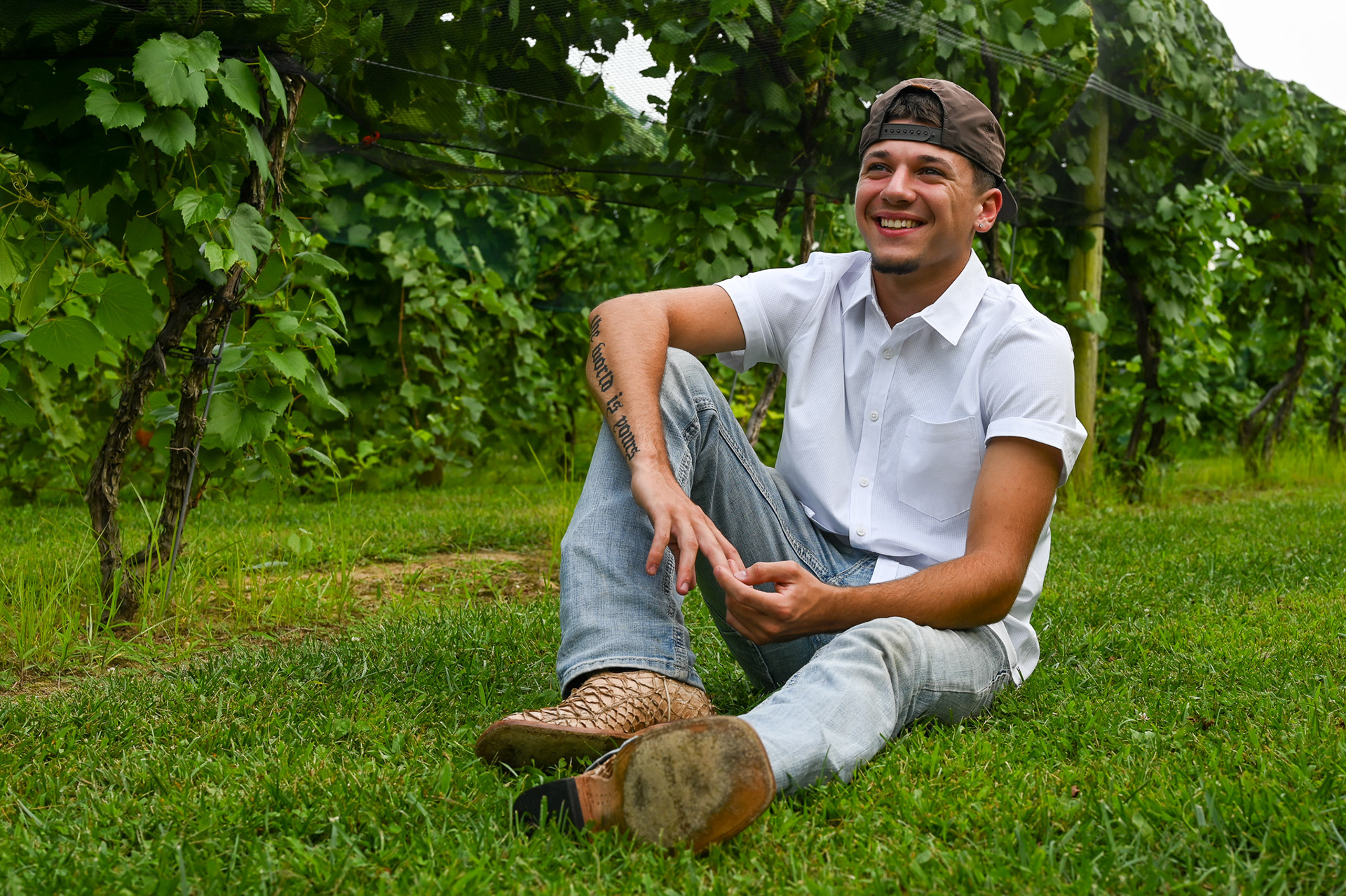 Dean Lucas poses for his senior photos at Gervasi Vineyard in Canton, Ohio on Thursday, August 15, 2024.