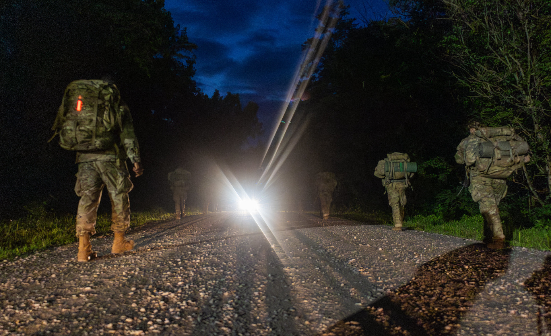 Cadets with 8th Regiment, Advanced Camp, step off to begin their 12-Mile Foot March on Densberger, August 2, 2024. Cadets finish up Cadet Summer Training with determination, emerging from the field to complete a 12-mile night march as the final challenge of their training. |Photo Credit: Ayiana Andrella, Ohio University, CST Public Affairs Office