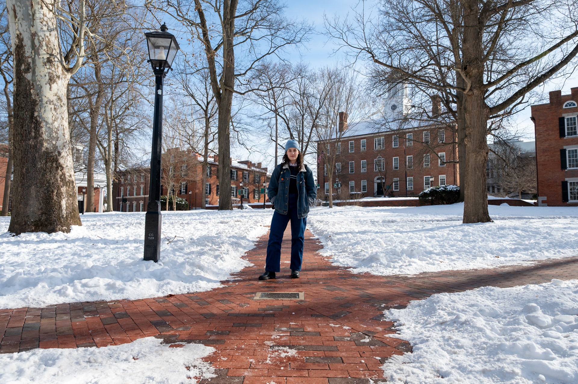 Mary Moser, a freshman, walks across the College Green at Ohio University on Friday, Jan. 30, 2026. After being driven back to campus by her parents on Monday and returning to ongoing winter conditions, Moser spent much of her time indoors, coexisting closely with her dorm roommate and limiting trips outside to classes, meals, and occasional exercise. On her first day back to in-person classes, she made her way across campus quickly, only venturing outside when necessary and relying on snacks in her dorm in between.
