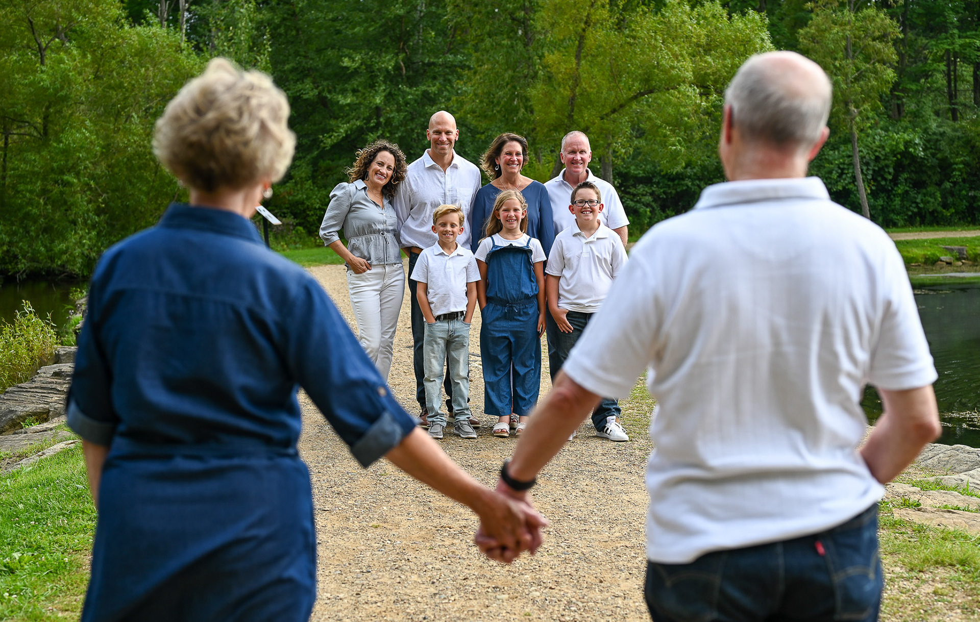 The Neill family poses for family photos at Little Turtle Pond in Green, Ohio, on Friday, August 15, 2024.