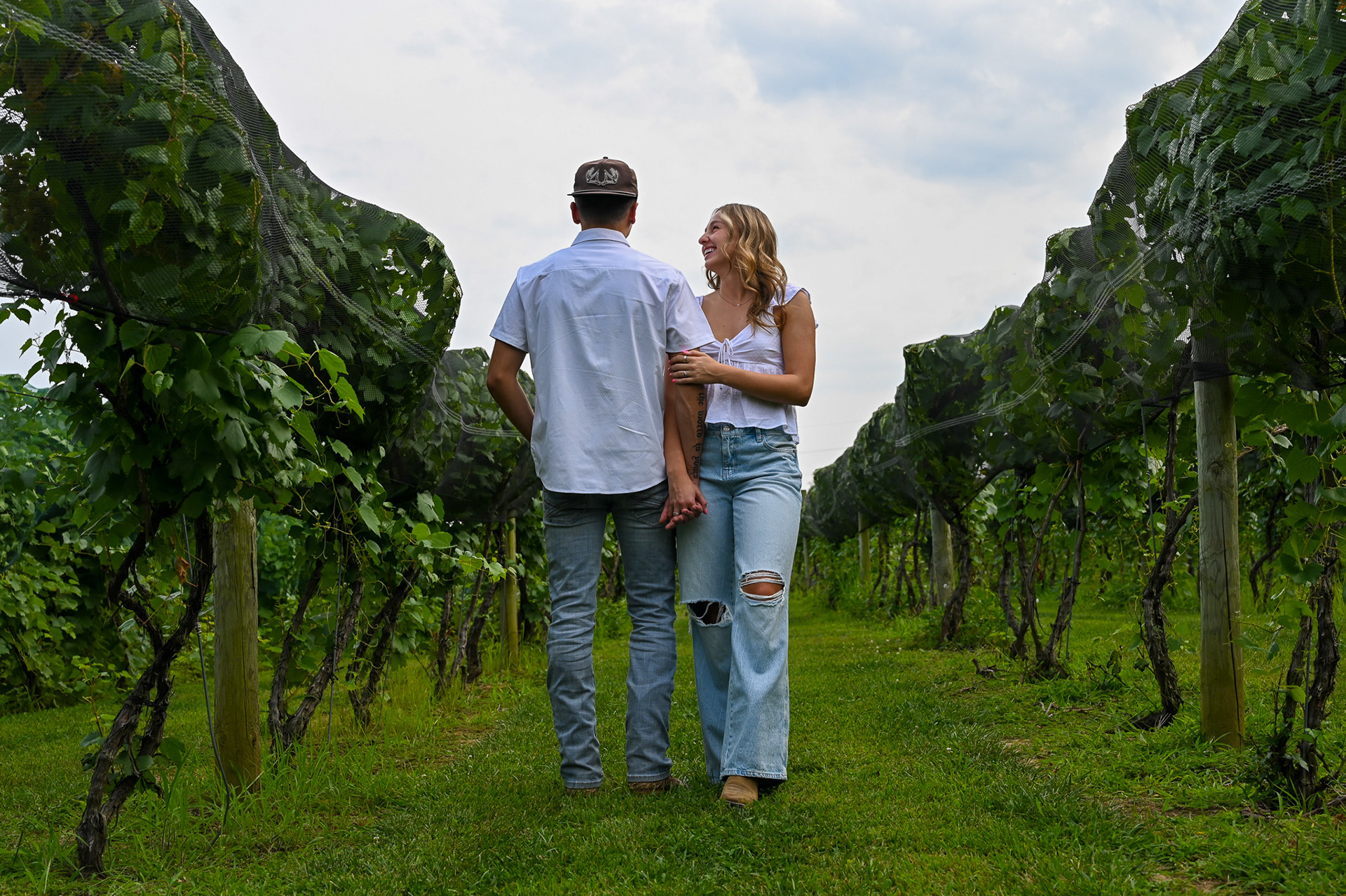 Dean Lucas, left, and Ava Andrella, right, poses for their couple photos at Gervasi Vineyard in Canton, Ohio, on Thursday, August 15, 2024. 