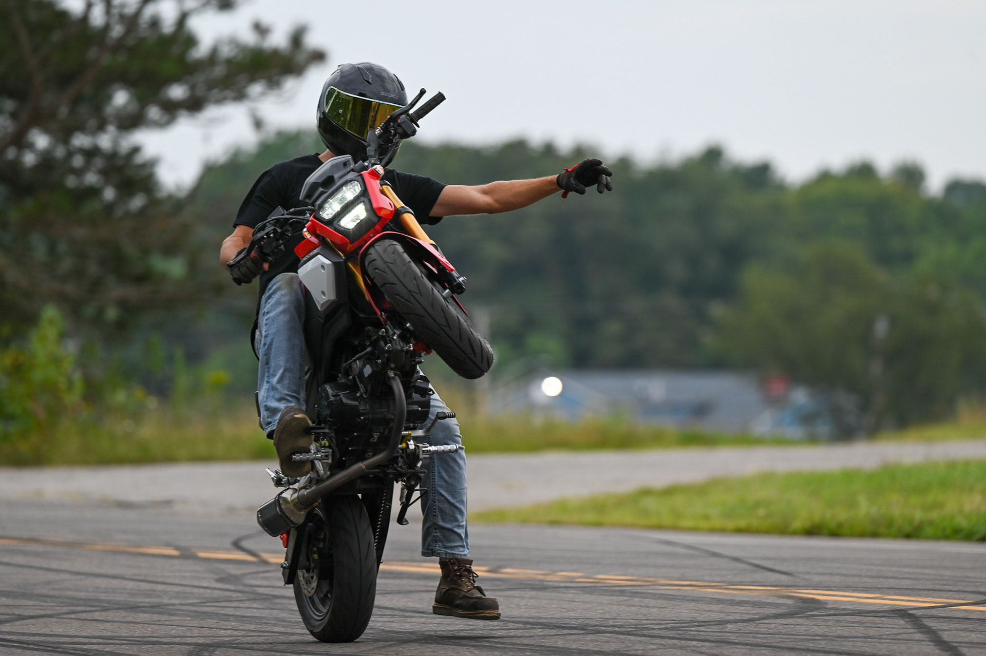 Dean Lucas poses while he rides his Honda Grom in Akron, Ohio on Thursday, August 15, 2024.