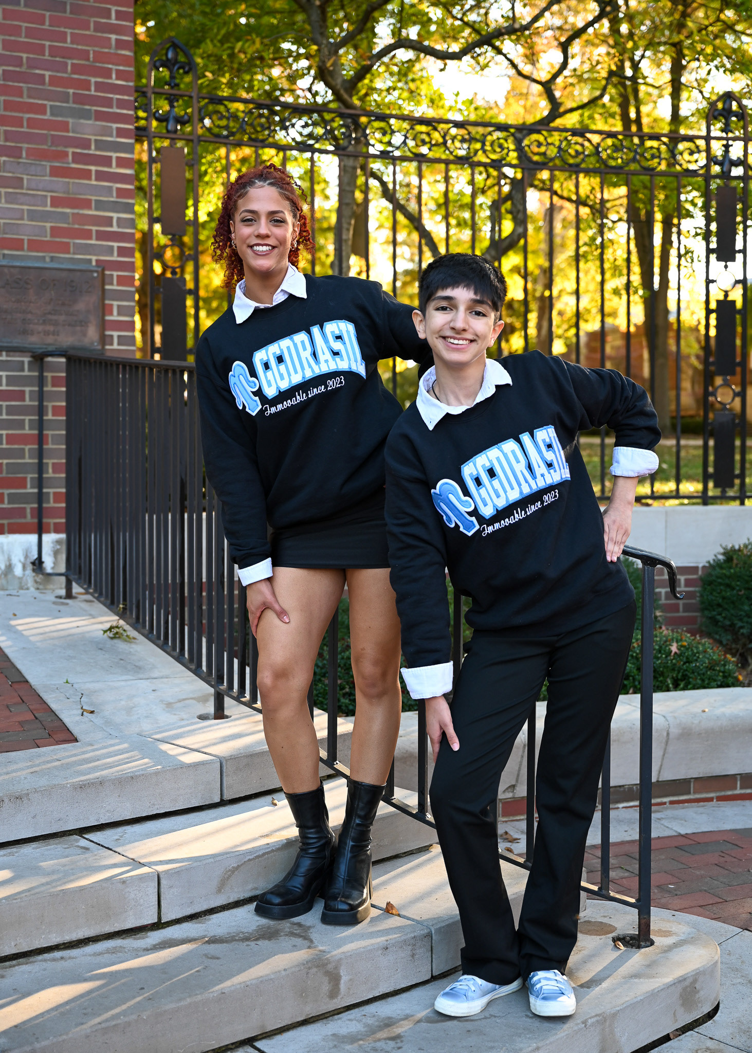 Liset Morales, left, and Cecilia Cervantes, right, pose for their Mu Sigma Upsilon sorority photos on the College Green at Ohio University in Athens, Ohio, on Monday, Oct. 21, 2024.