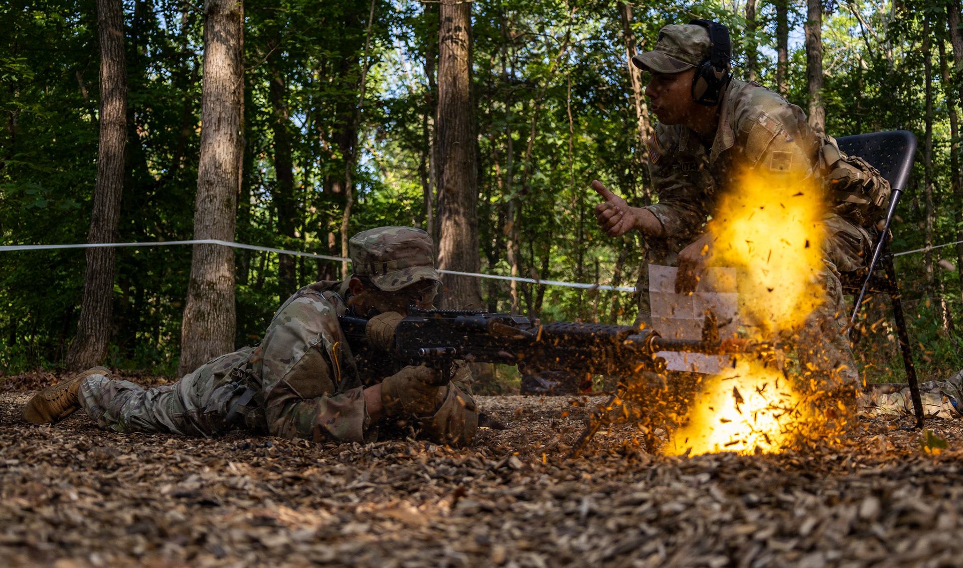 Cadet Oscar Carranza from Texas State University, with 4th Regiment, Advanced Camp, operates a M240B machine gun on Fort Knox, KY., June 30, 2024. Cadets will initially fire blanks from the weapon and subsequently apply their training to effectively clear any malfunctions, ensuring the weapon is swiftly restored to operational status. | Photo Credit: Ayiana Andrella, Ohio University, CST Public Affairs Office