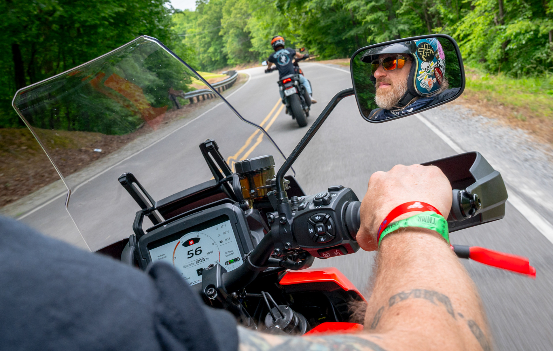 Austin Andrella test rides a Harley-Davidson Pan America during the Tennessee Motorcycles & Music Revival at Loretta Lynn’s Ranch in Hurricane Mills, Tenn., on May 16, 2026. Andrella follows his daughter’s boyfriend, Dean Lucas, as they participate in Harley-Davidson test rides, a major feature of the annual event. Eventgoers 18 and older were able to ride along the scenic route at Loretta Lynn’s Ranch as many times as they wanted, choosing from the newest Harley-Davidson motorcycles.