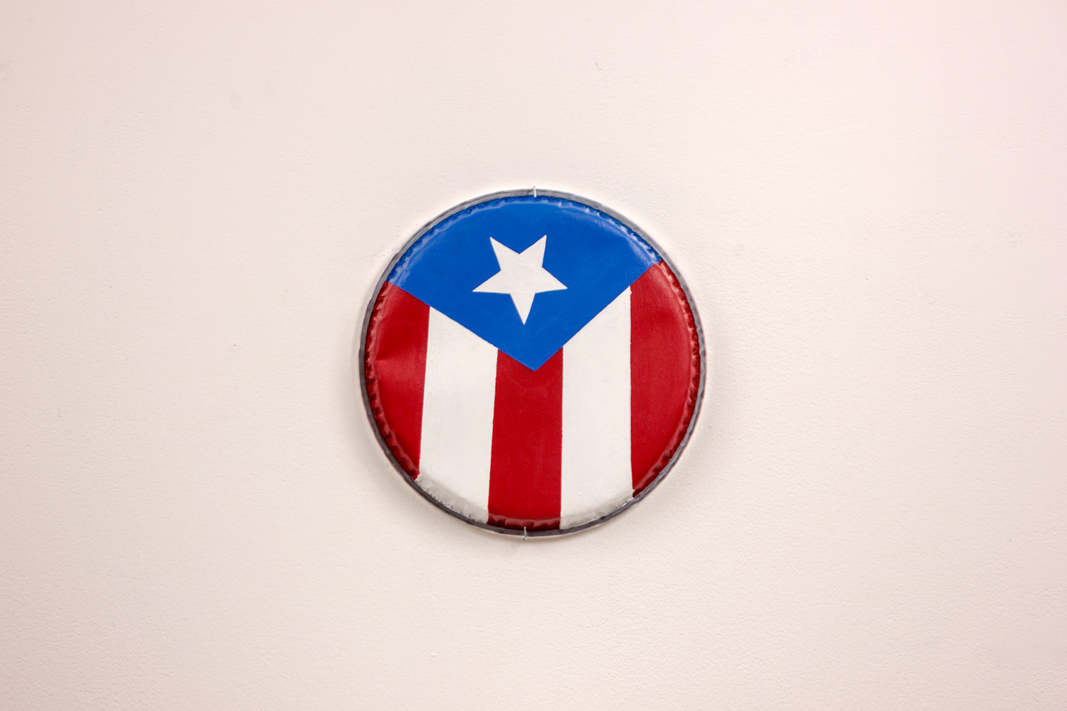 La Bandera, 2025, Acrylic Paint on Conga Headrum, 1.6 x 11.5 x 11.5 inches