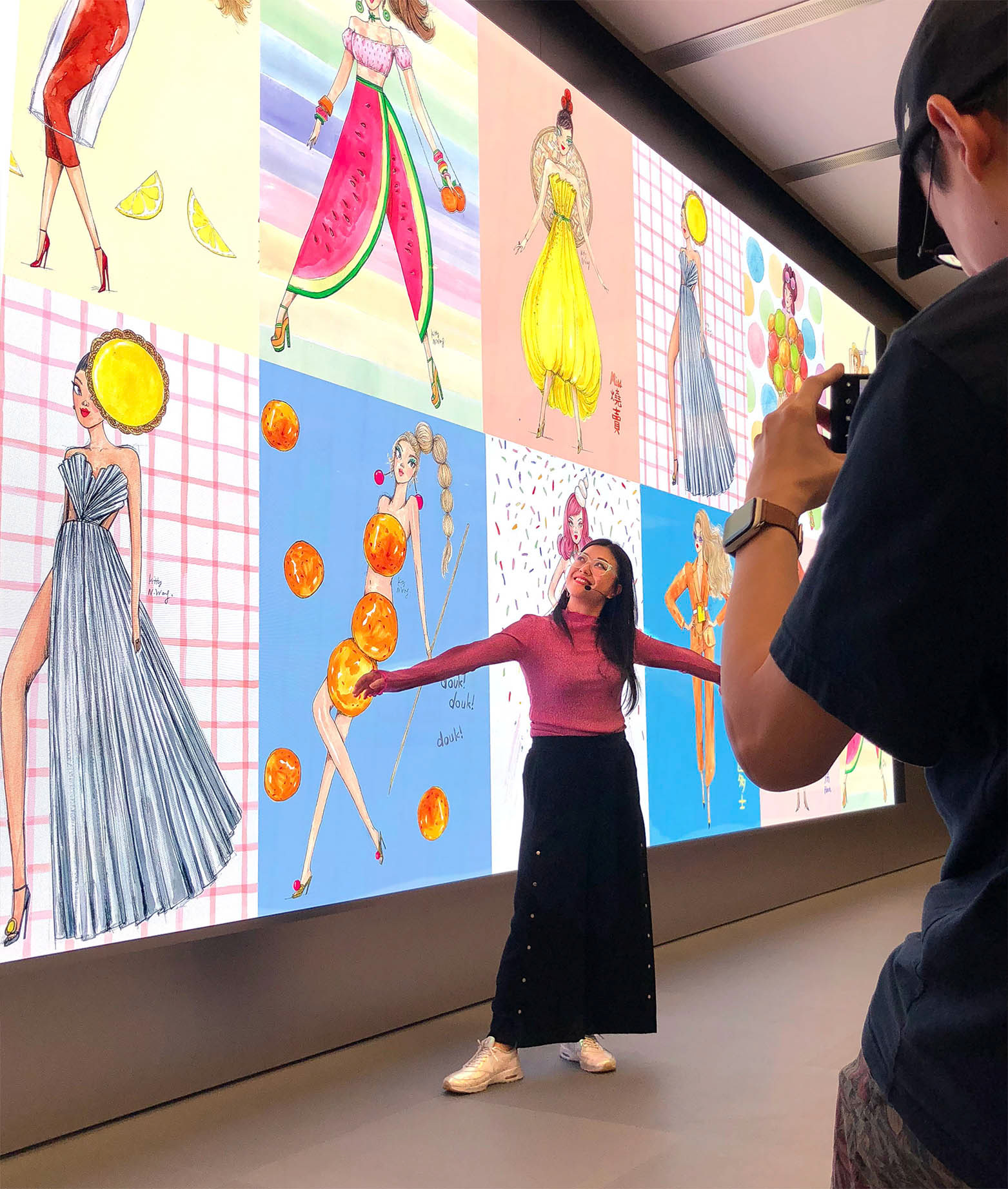 Hong Kong illustrator posing for photographer wearing headset at Apple Store