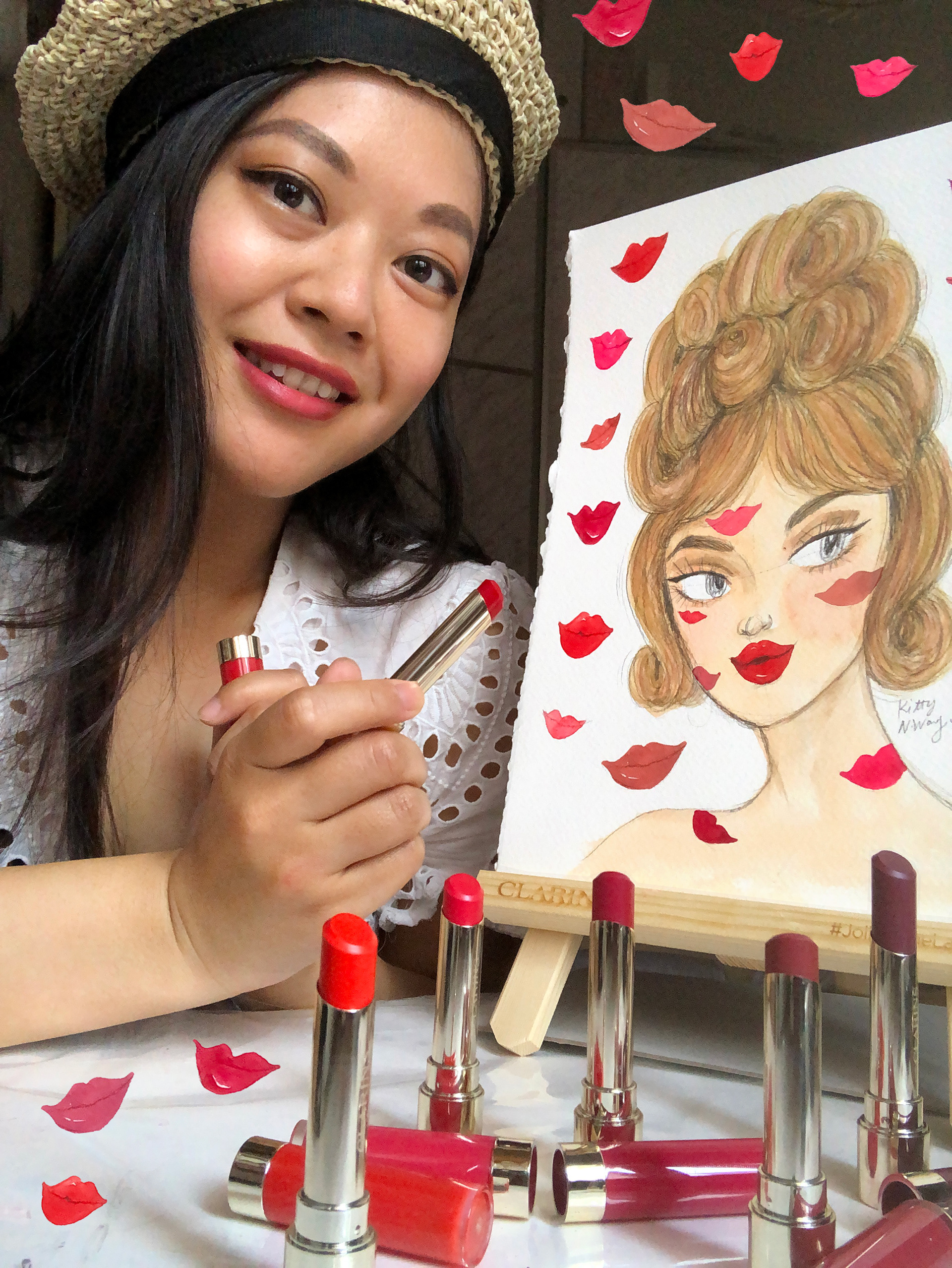Asian woman artist wearing beret painting a beautiful face with red lips on table easel