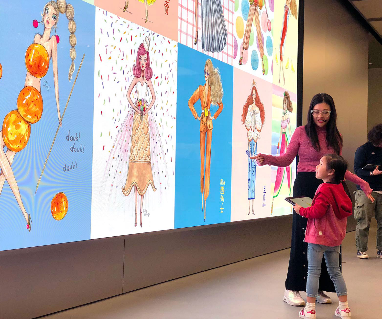 Hong Kong female illustrator teaching art to small child student at Apple store