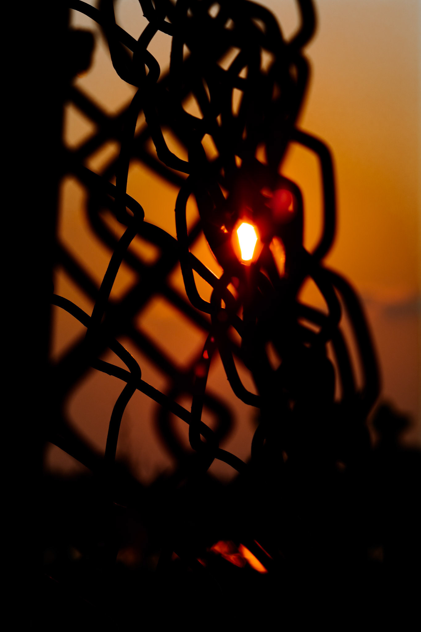 Chainlink Flares. Shot with: Nikon D5200 + Vivitar 85-205mm.