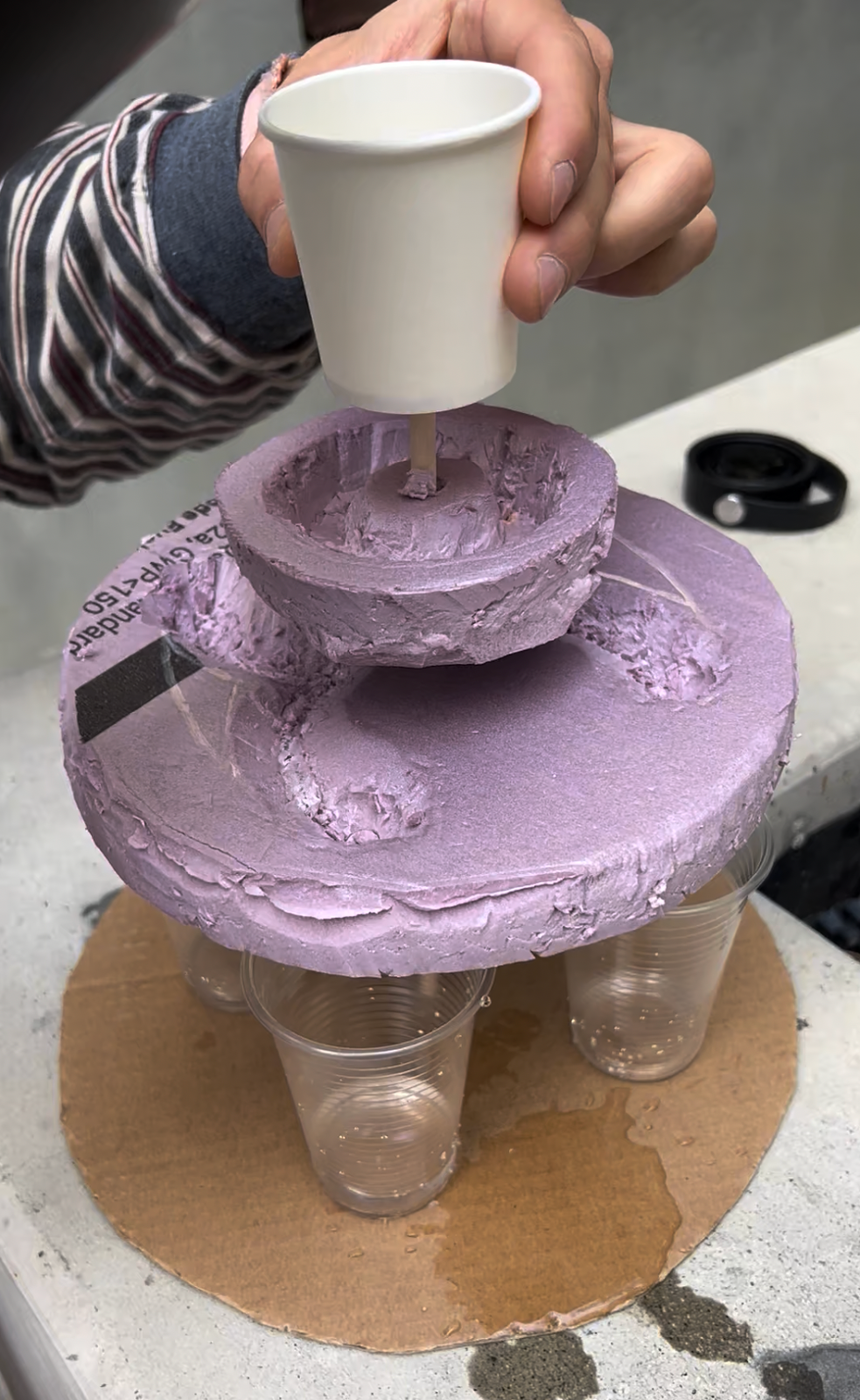 Prototype #2 features a top cup with two plates that divert the liquid stream.