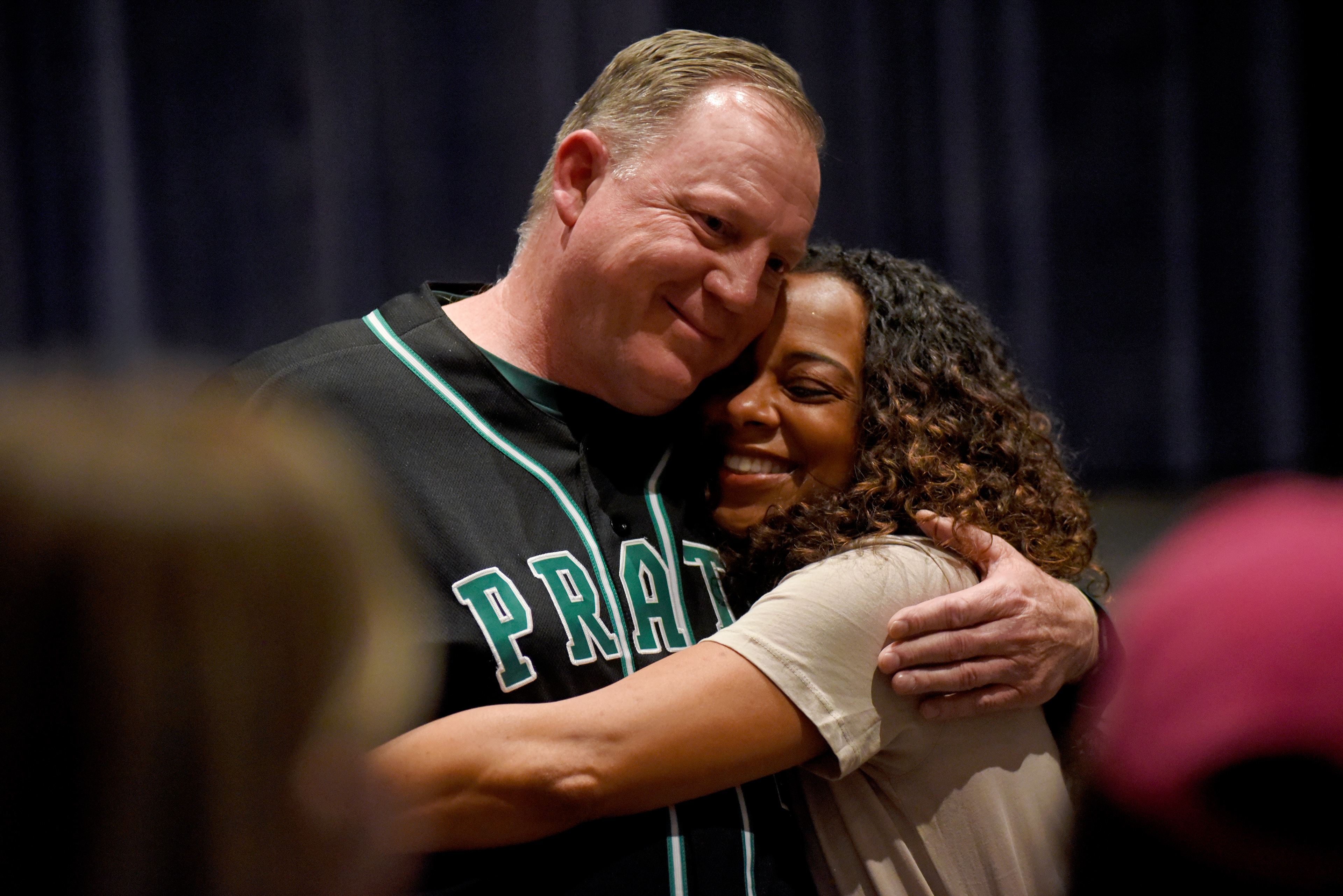 Nischelle Turner hugs Jon Meyers on Thursday at Rock Bridge’s Performance Arts Center. Turner said Meyers, her journalism teacher at Rock Bridge, was one of the main reasons she went into journalism.