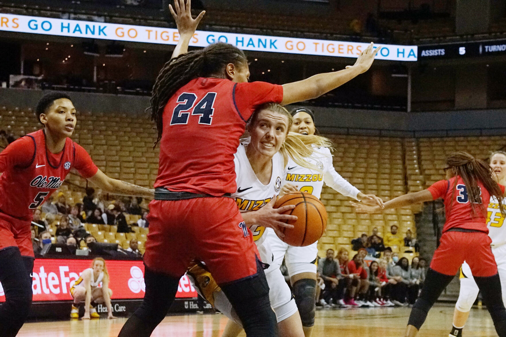 Missouri guard Haley Troup is met by Ole Miss forward Madison Scott during a drive to the basket Thursday at Mizzou Arena in Columbia. The Tigers lost the game 61-45.