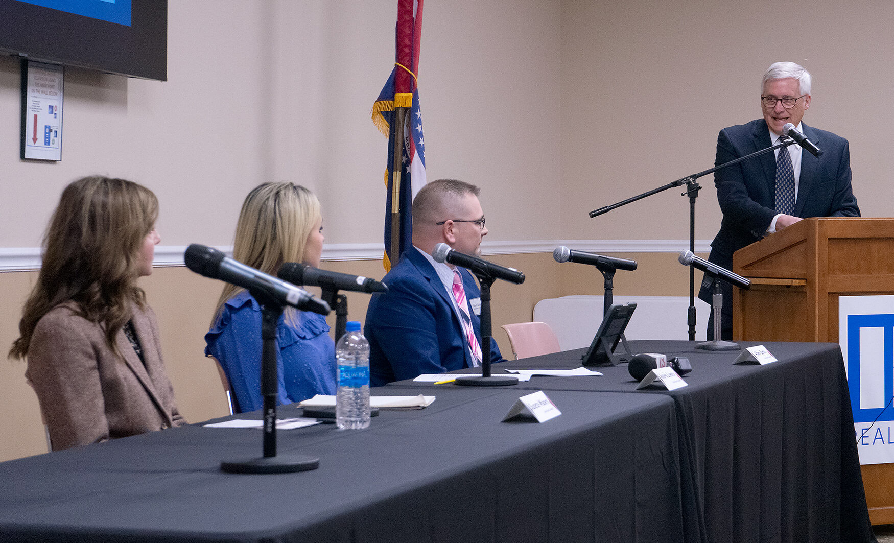 David Lile, right, asks candidates, from left, Suzette Waters, Andrea Lisenby and Adam Burks a question at the Mark Farnen Candidates Forum for the upcoming Columbia School Board election on Thursday.