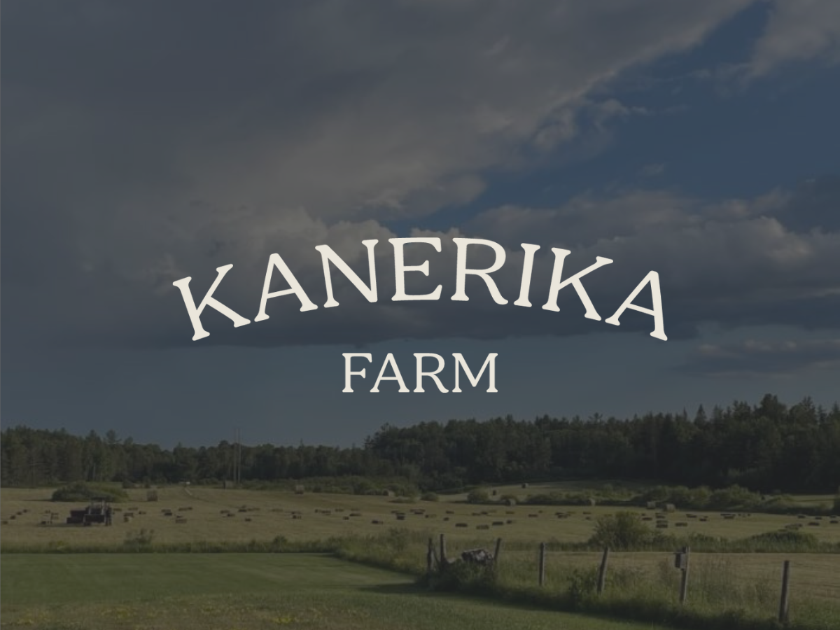 The Kanerika Farm logo over a photo of the farm landscape