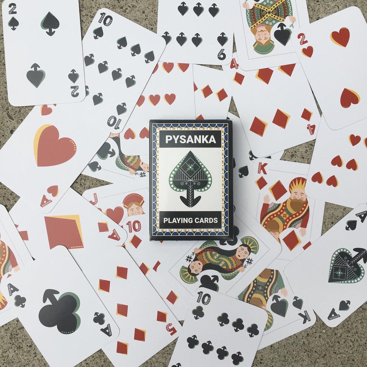Pysanka card deck with illustrated cards behind