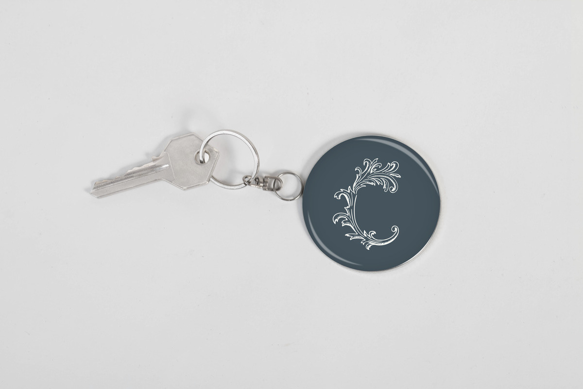 Keychain with the Chapel Street Guesthouse icon in blue