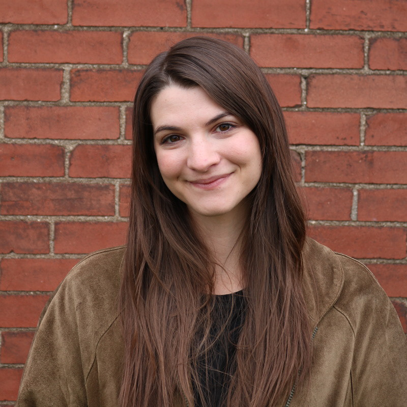 Photo of Michaella in front of a brick wall
