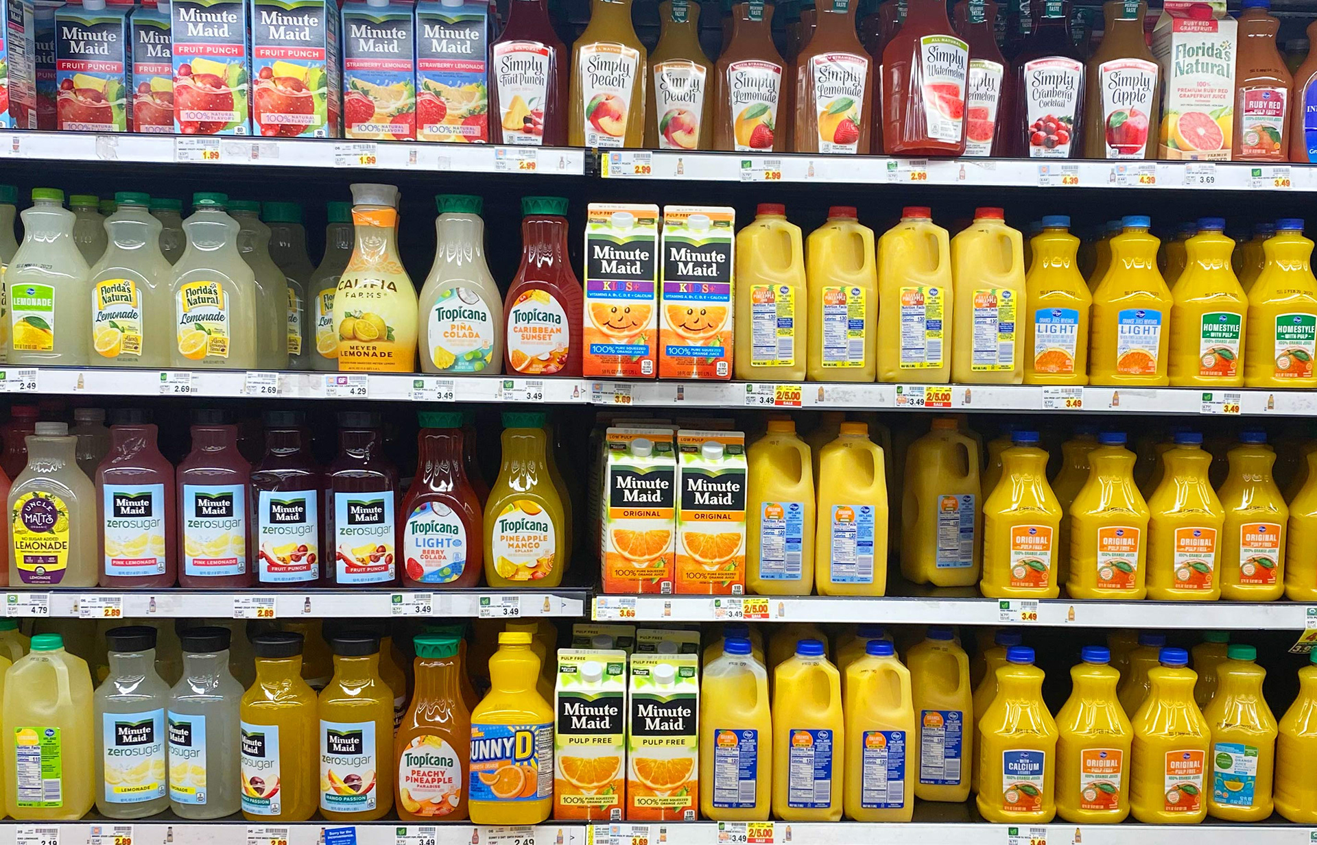 supermarket rack with orange juices
