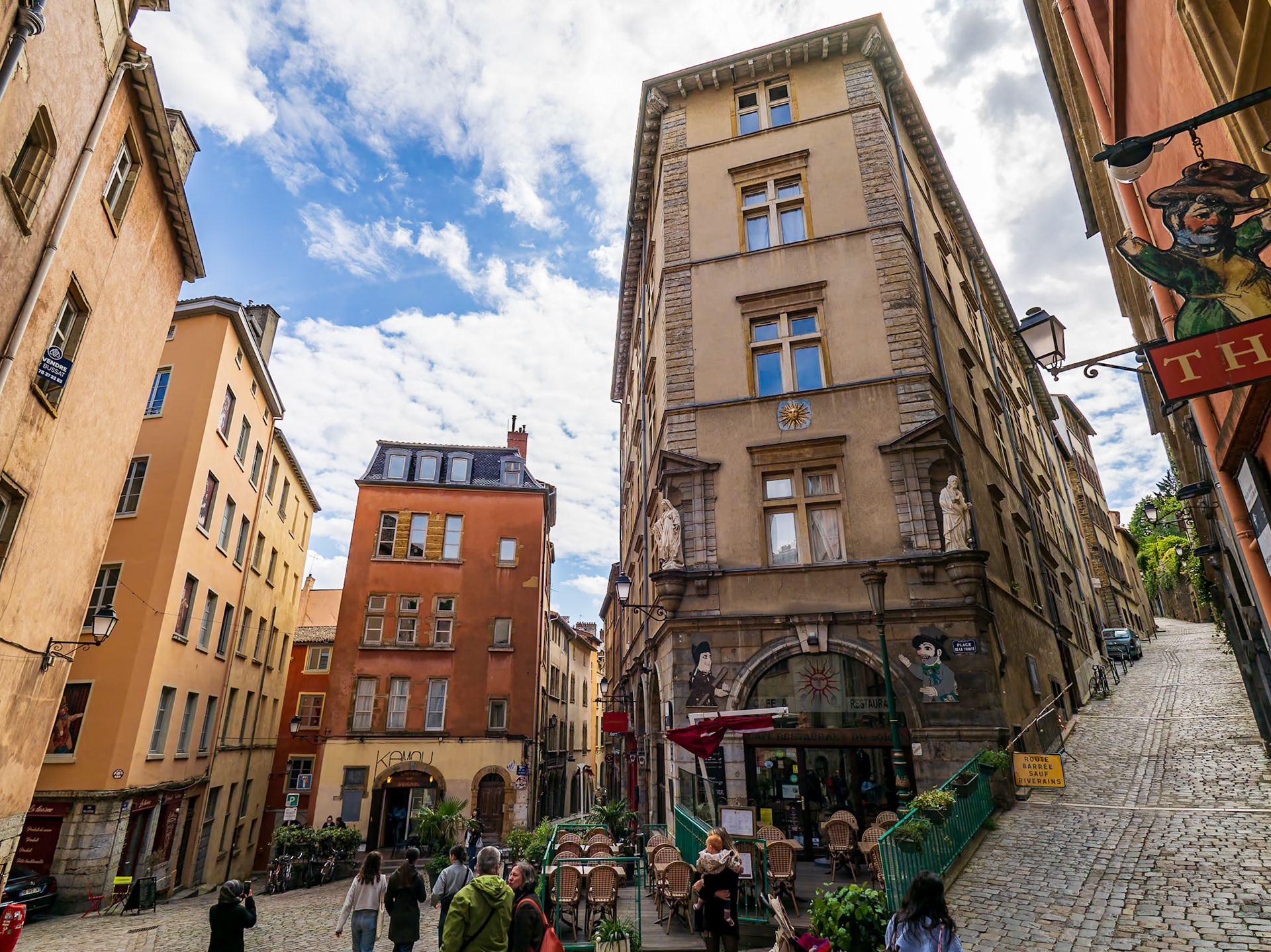 The Place de la Trinité is a square located in the 5th arrondissement of Lyon. The square, fully paved and surrounded by old buildings like the sun house (18th century), is more a crossing of small streets than a real square. It is on the hillside of Fourvière and is the low extremity of the hill of Gourguillon. The square is in the center of the zone classified as World Heritage Site by UNESCO.