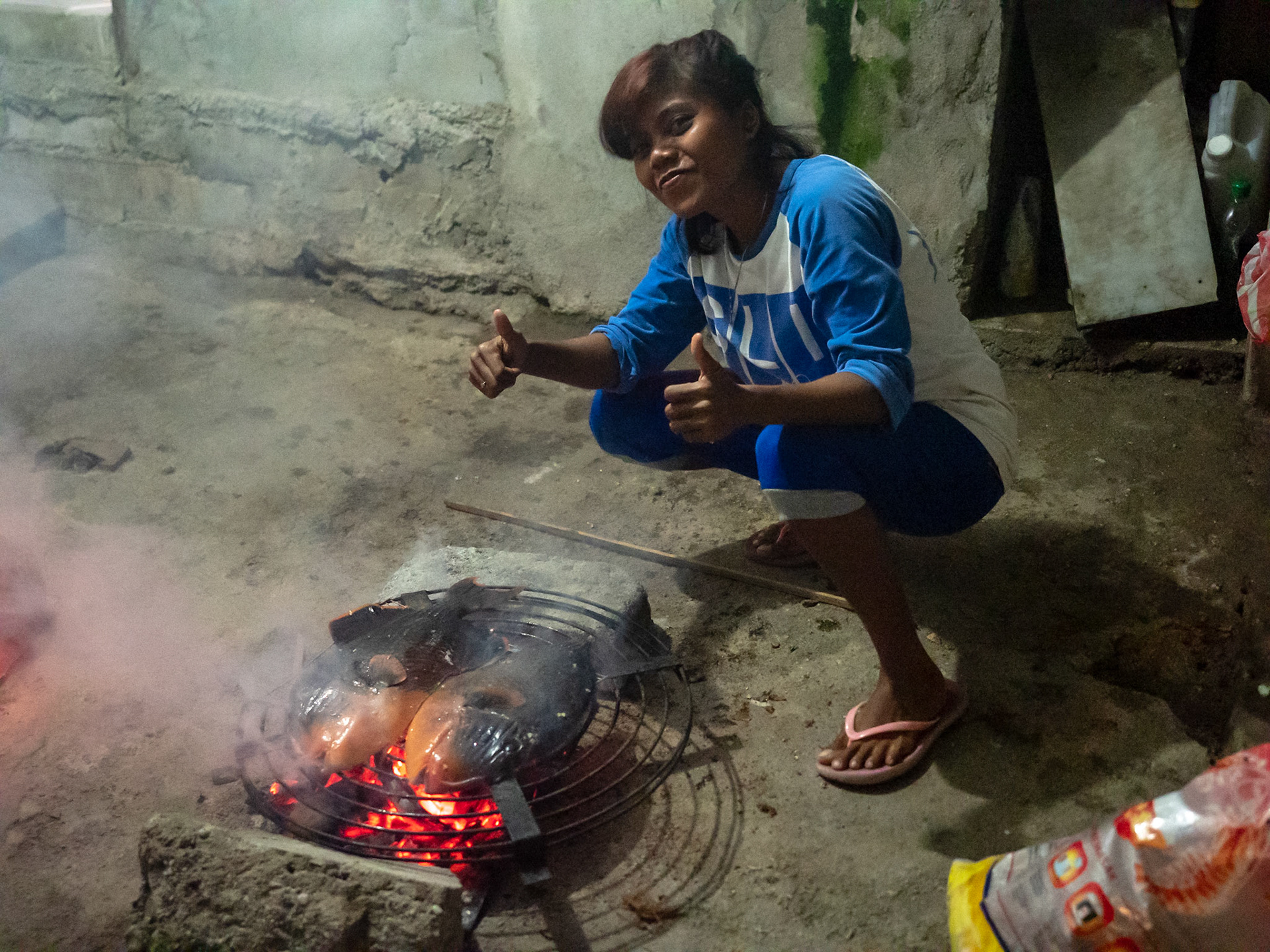 Trigger Fish Dinner on the grill - Waplau, Bura, Indonesia