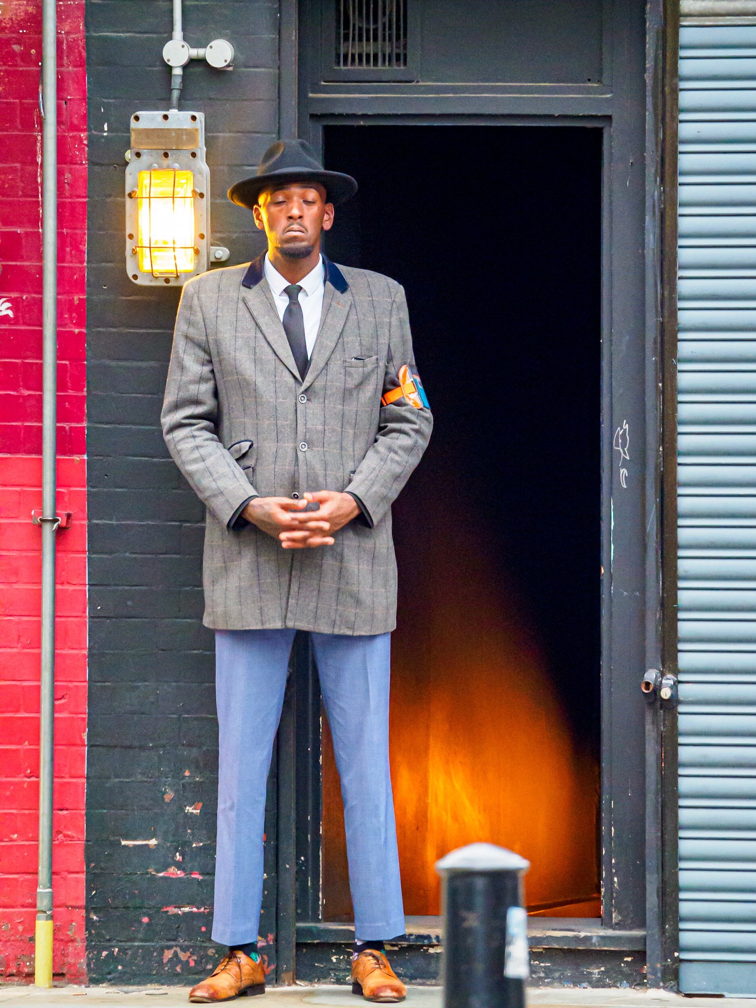 Streets of London - man in suit watching stairway entrance, London, England