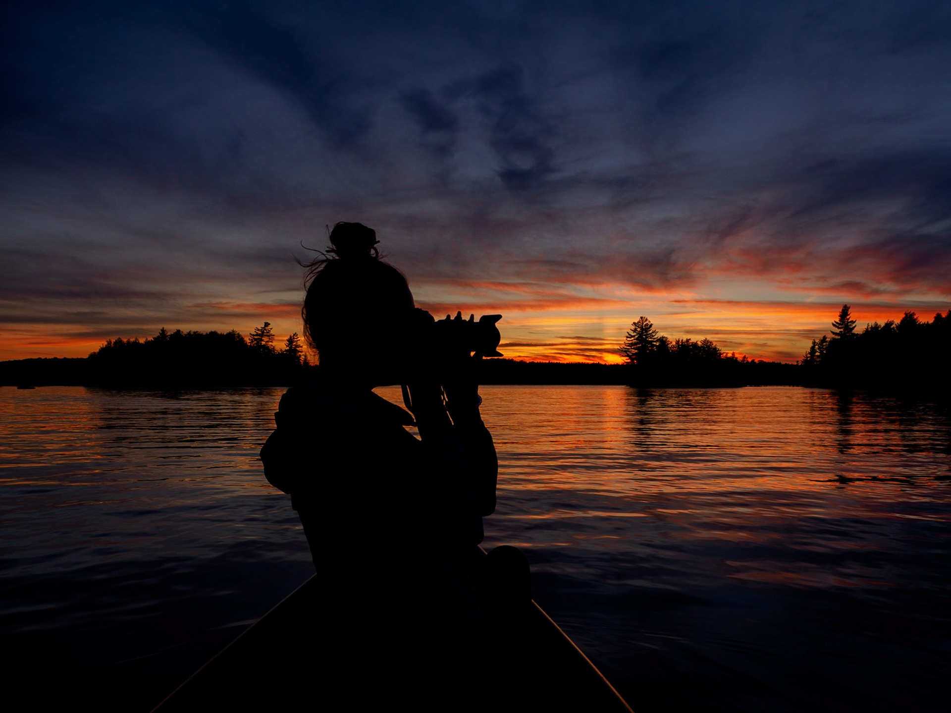 Tiffany sunset silhouette on Kennisis Lake, Haliburton, Ontario