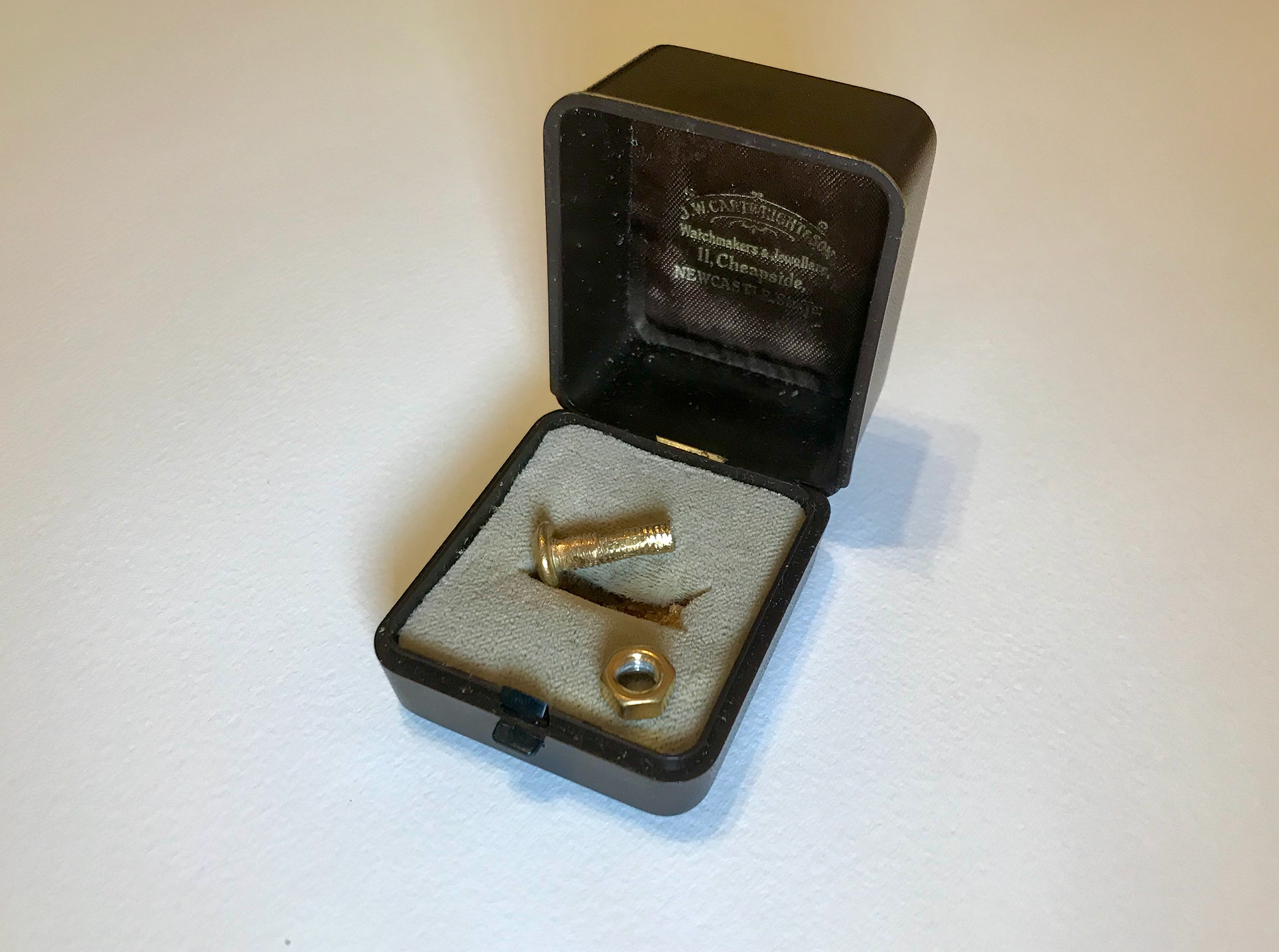 Divorce (After Marriage Simon Kennedy). Made in 2011 Filed down nut and bolt with case. 10k gold plated. Nut and bolt 18mm x 6mm x 6mm Case 45mm x 45mm x 30mm Price £100