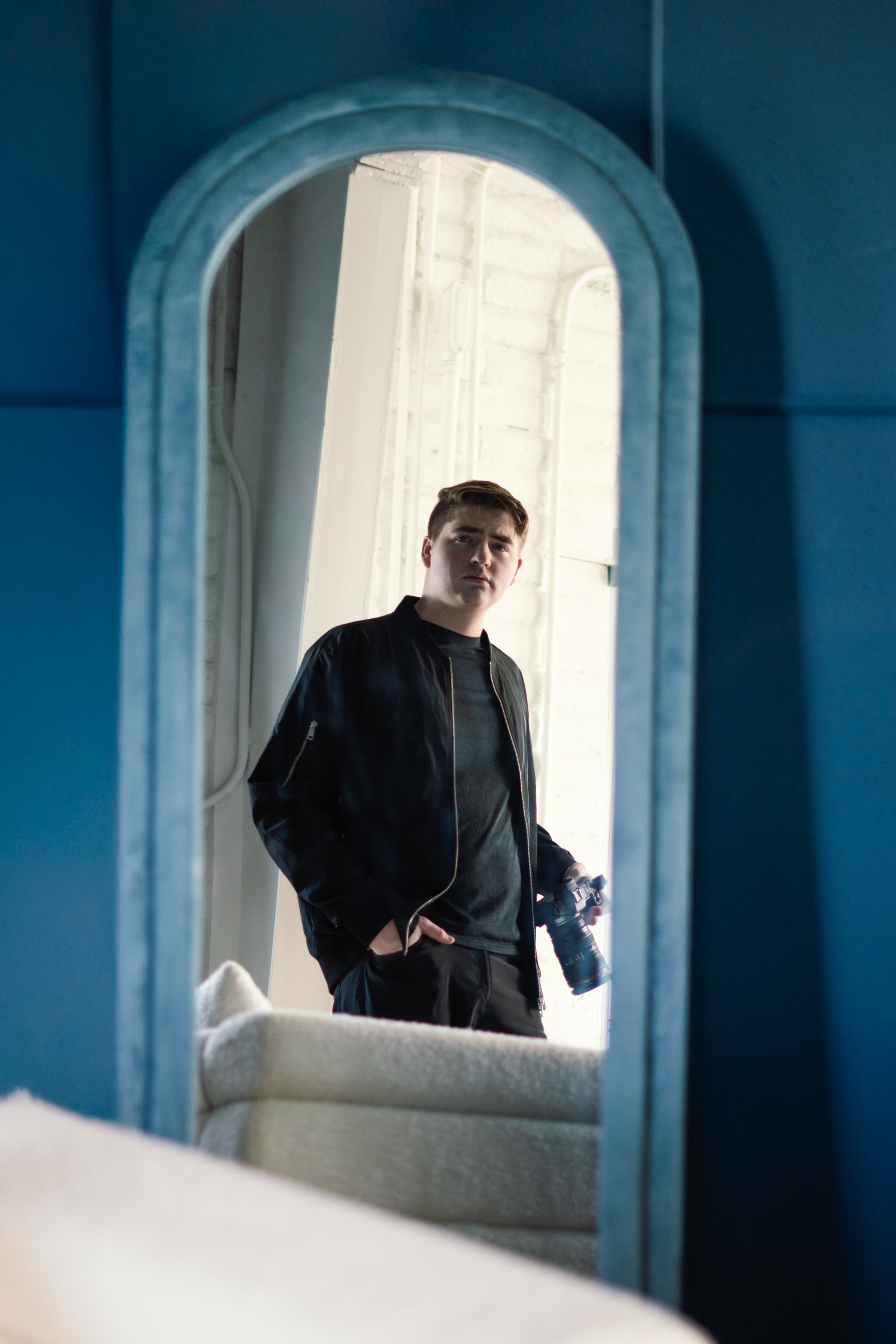 Person Looking in mirror holding camera