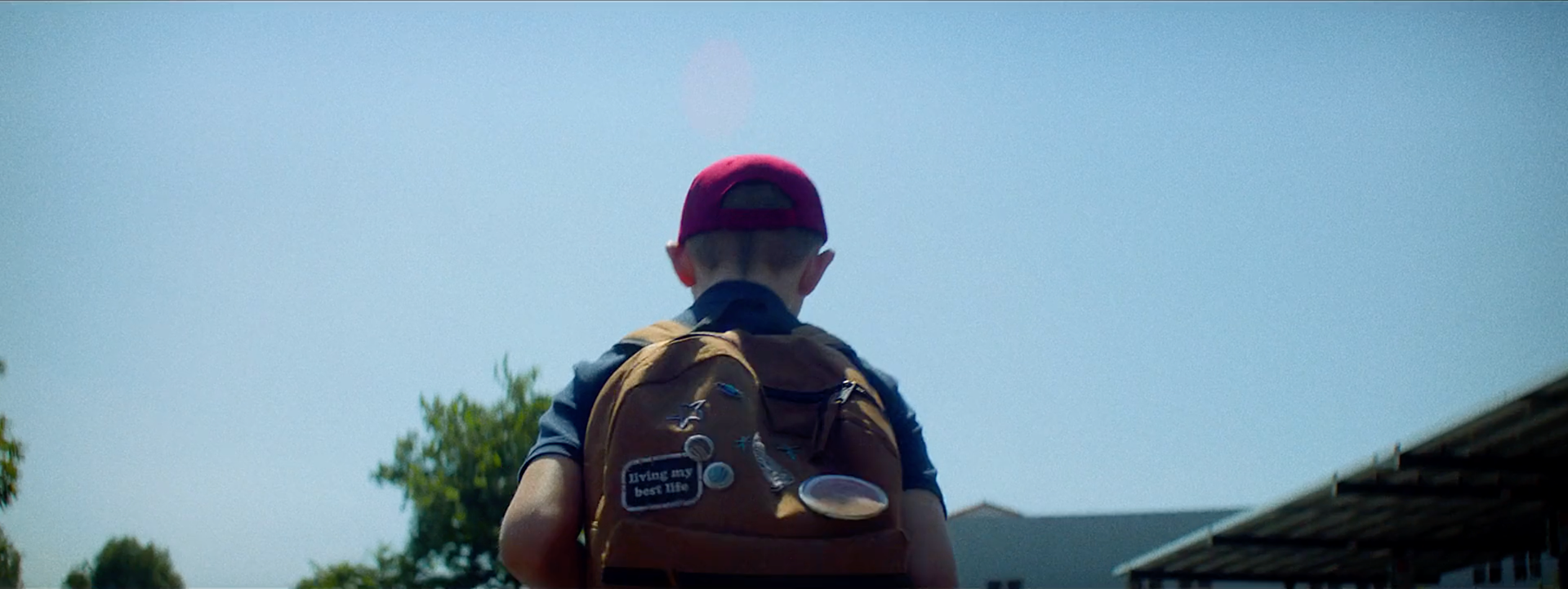 hero boy backpack played by Chris Martin