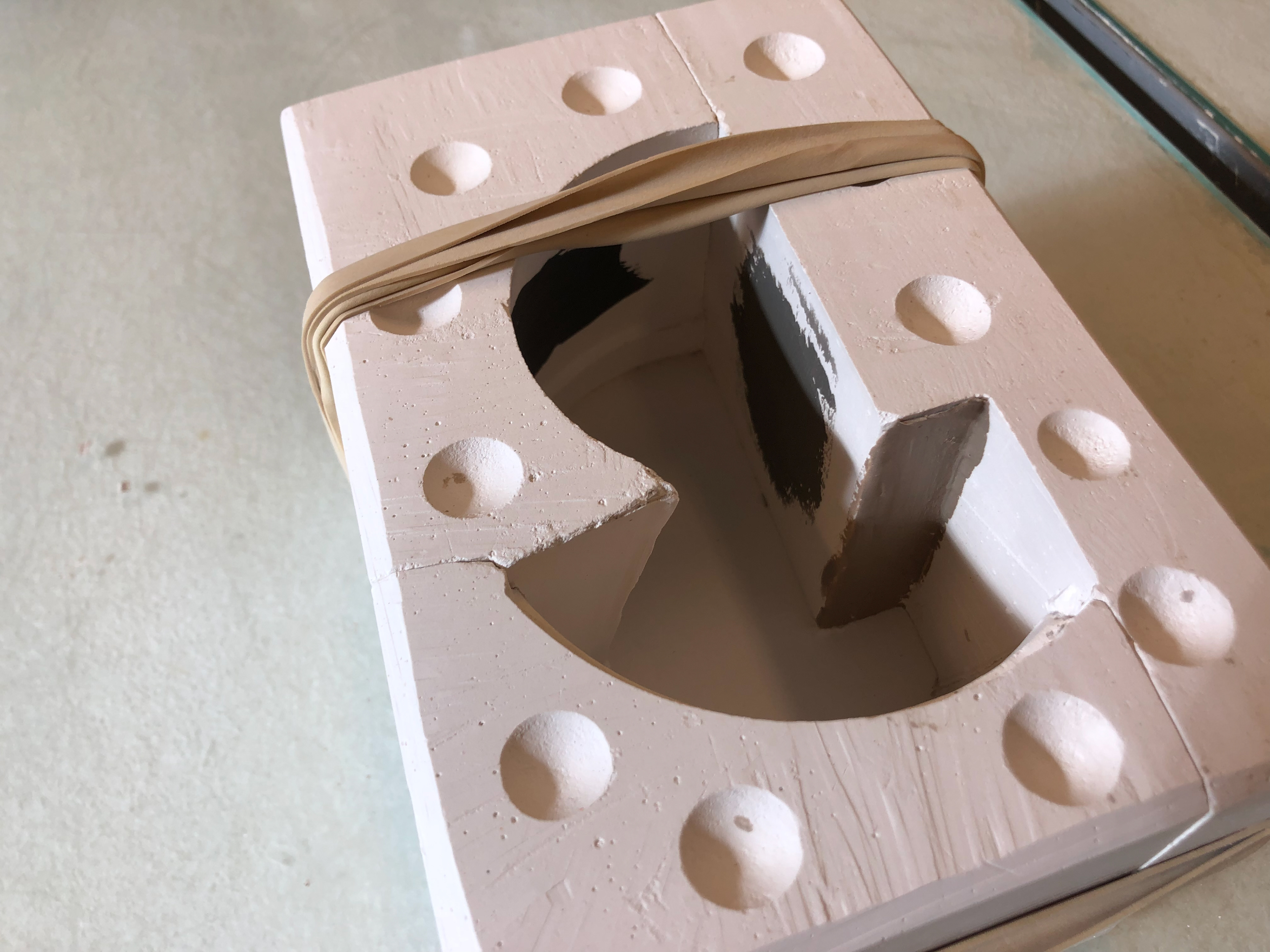 Blue slip painted onto the right side of the mould.