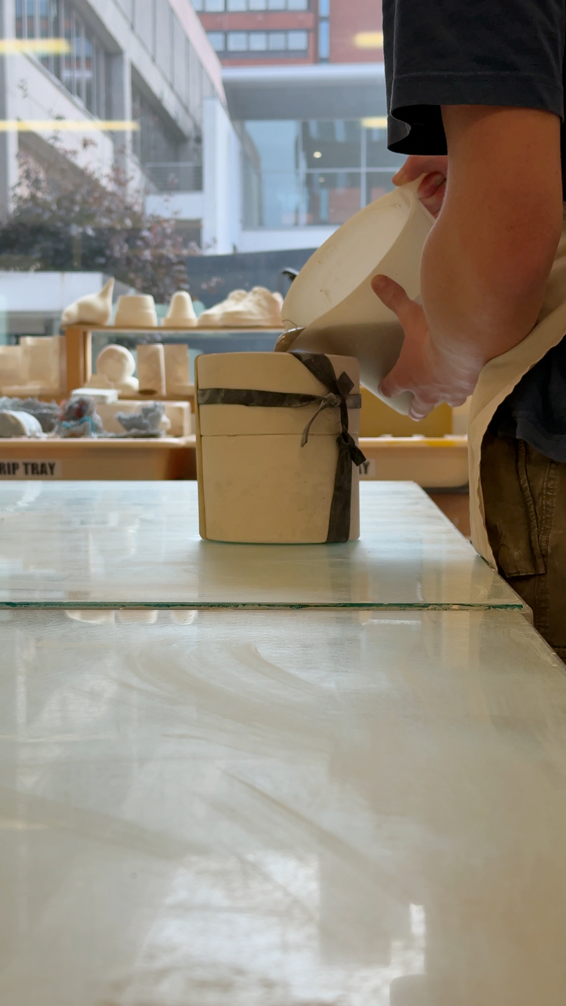 Pouring slip into the mould.