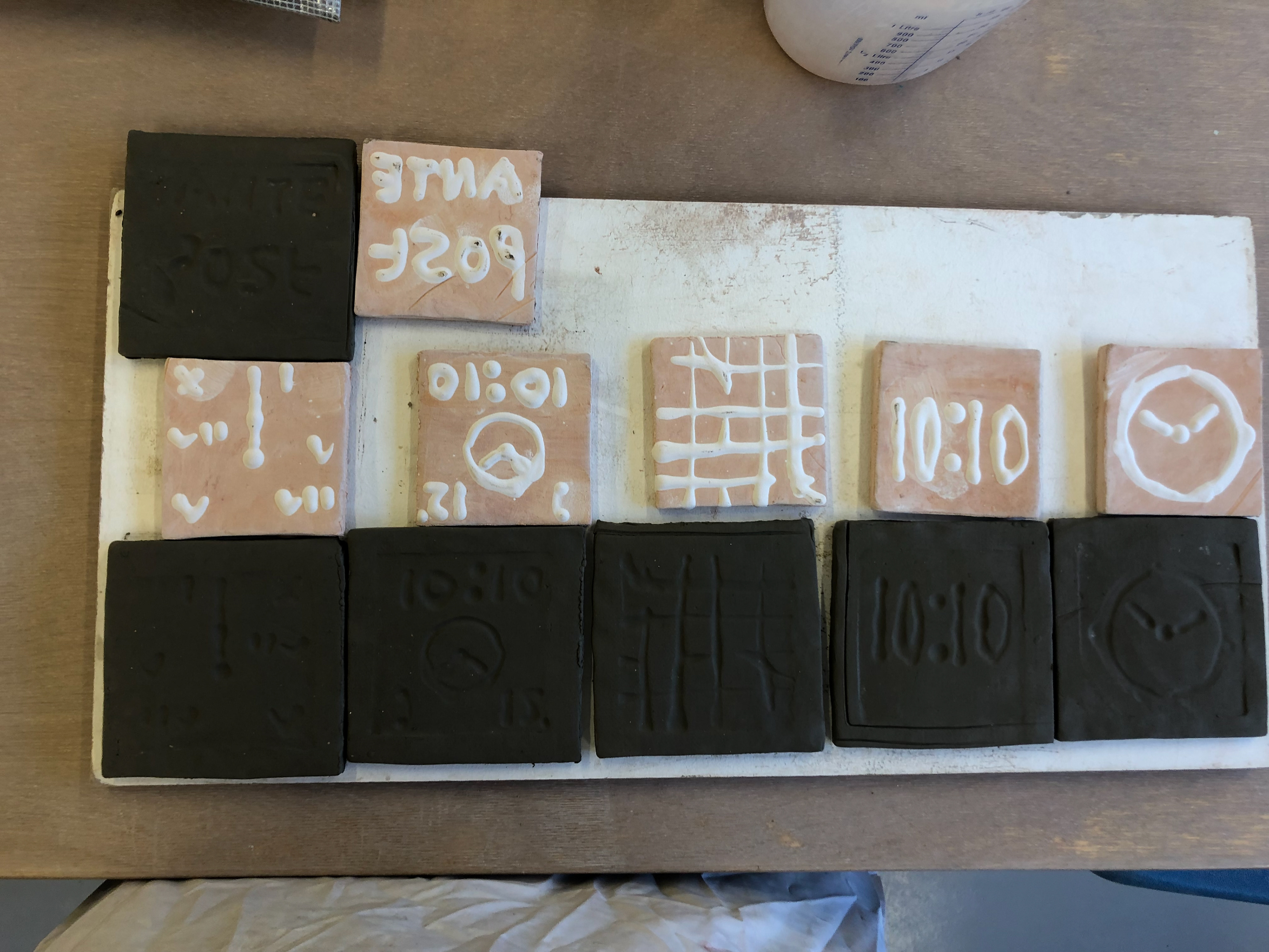"Pad printers" played next to the corresponding tile. Each tile is ready to be made into a final piece.