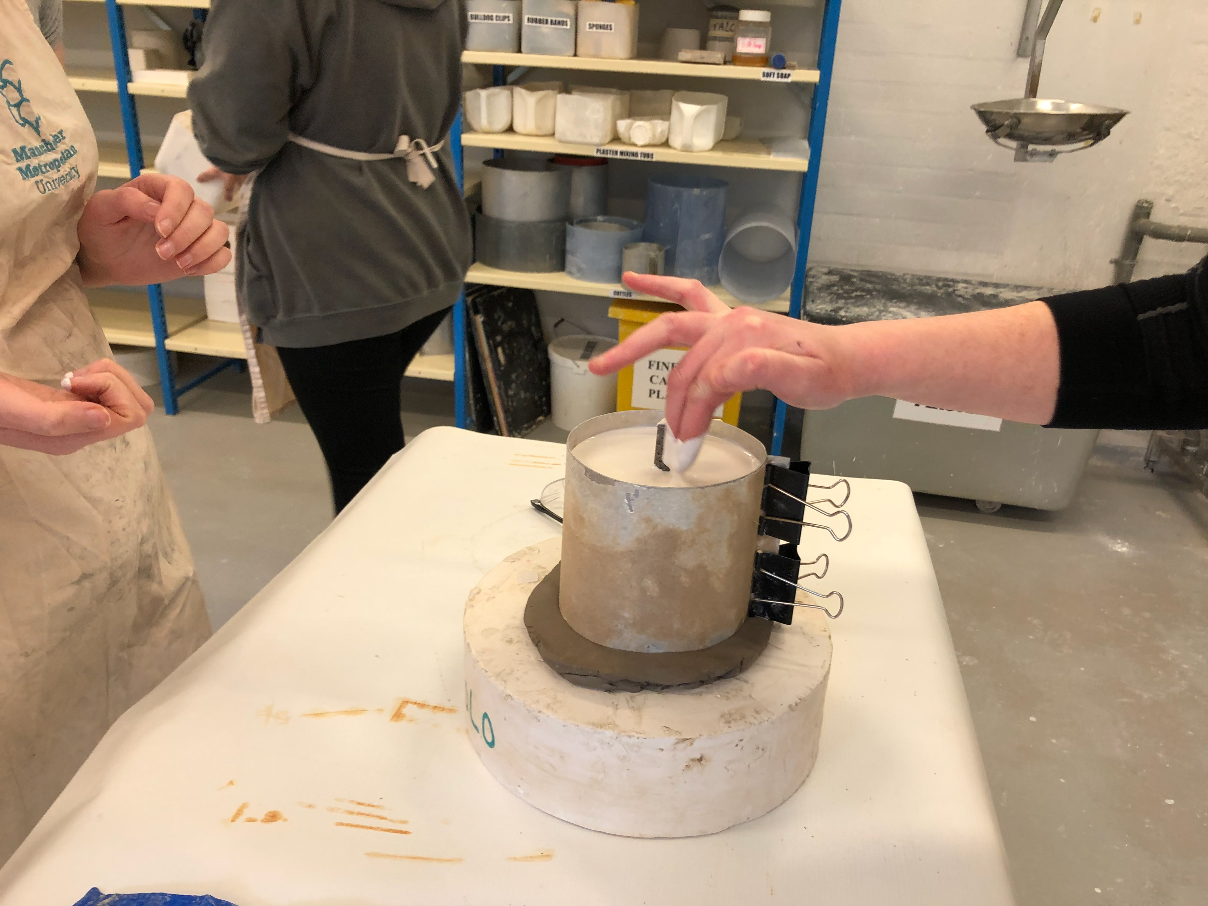 Tapping the plaster to remove any air bubbles.