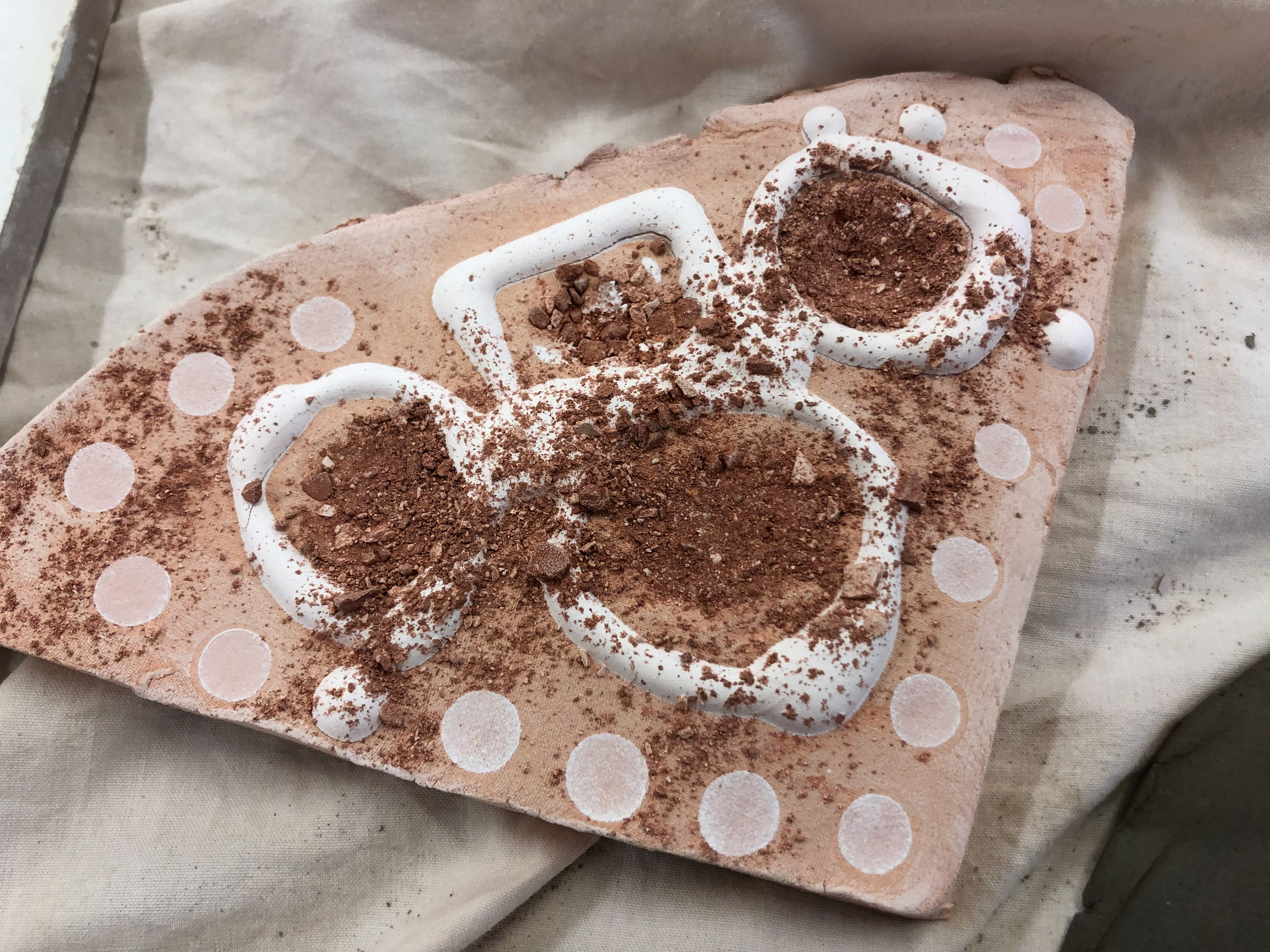 More detailed view of the now fired crushed clay and slip.