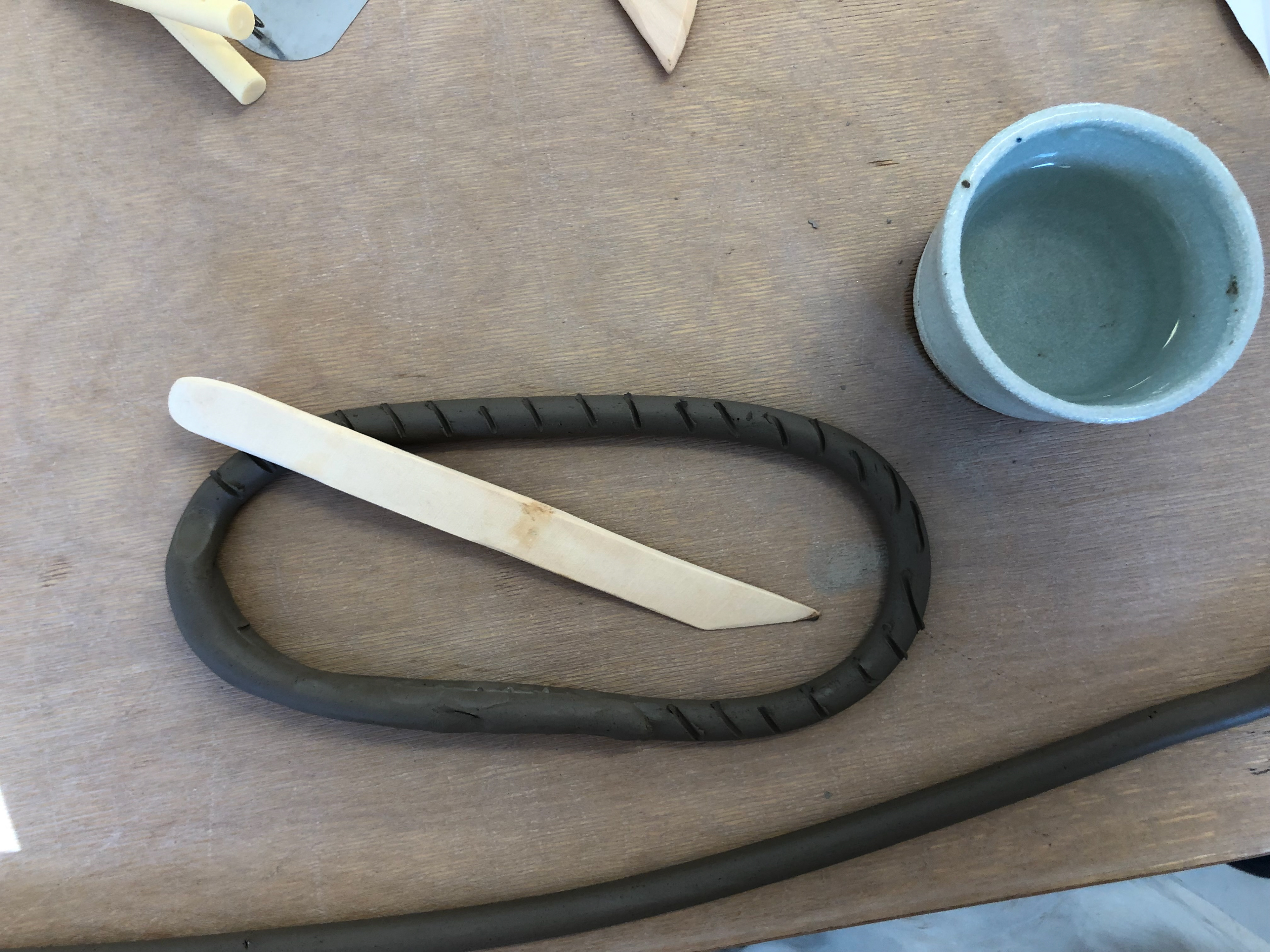 I indented marks into the clay and ran my finger over the clay with water to help the next layer attach.