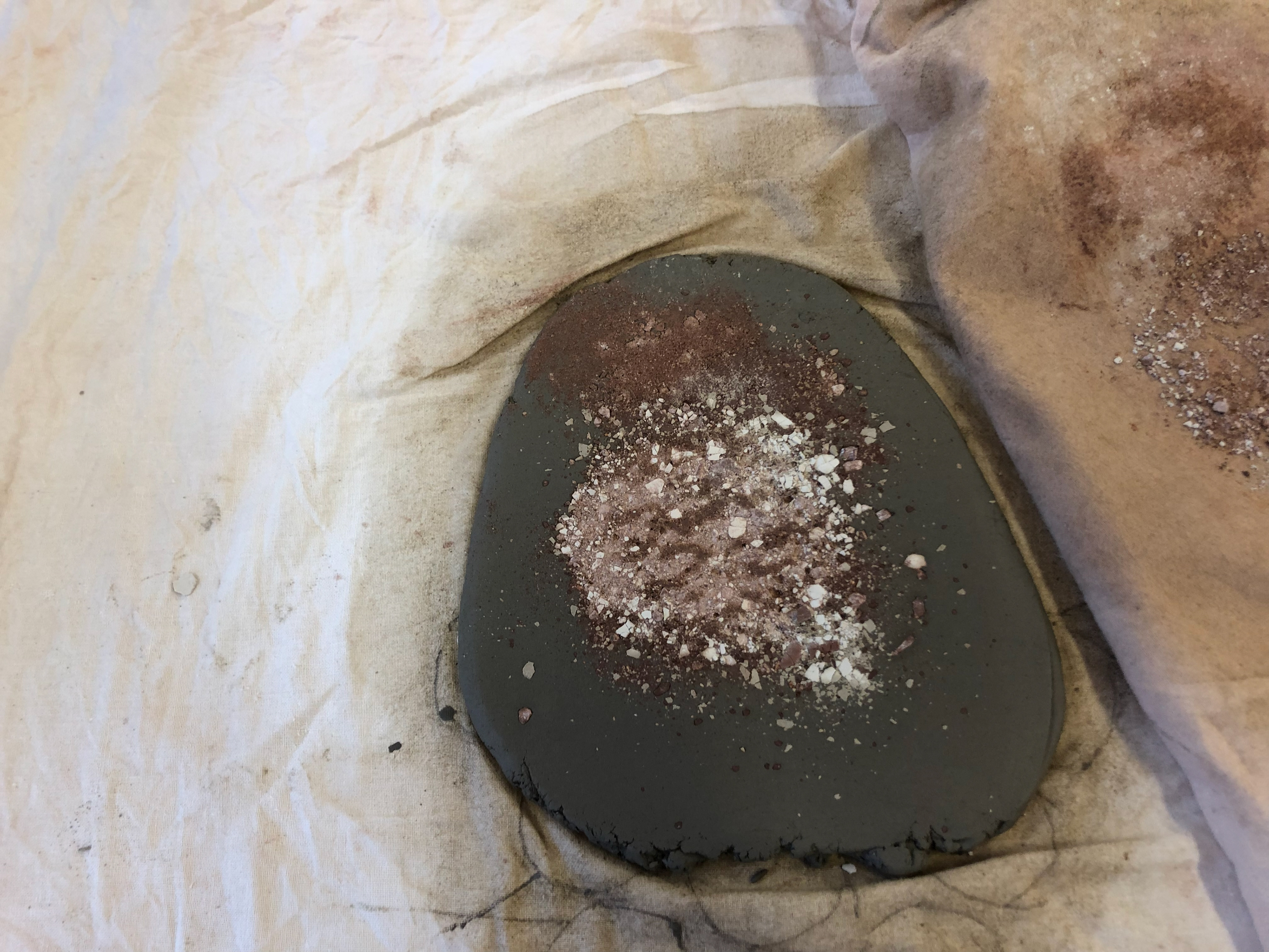 The crushed up leather hard clay rolled into clay