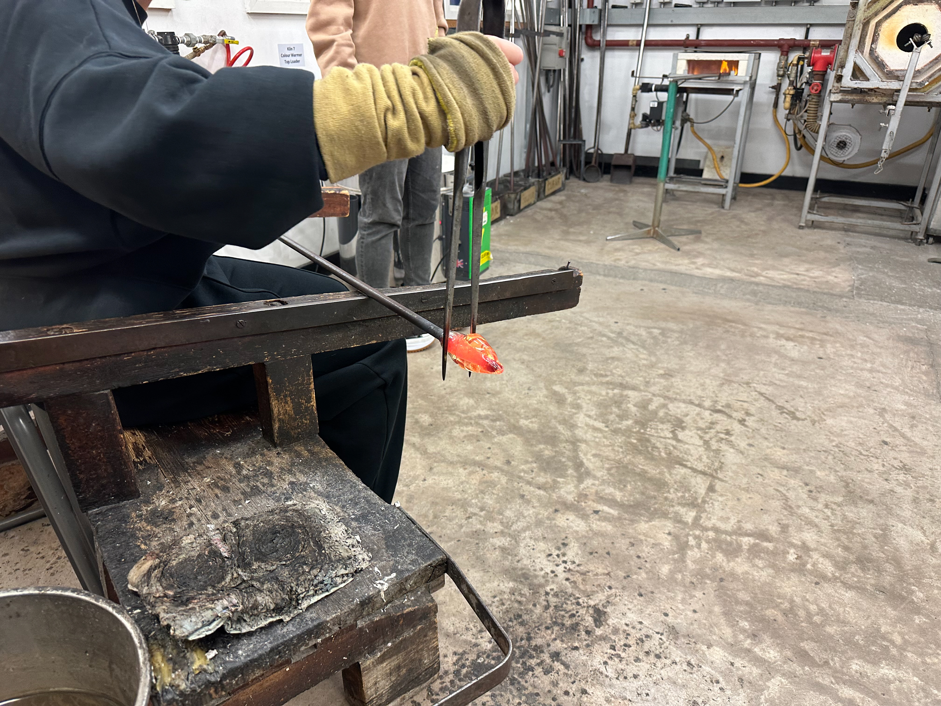 Using tweezers to create a thin ring to help allow the glass to fall off.