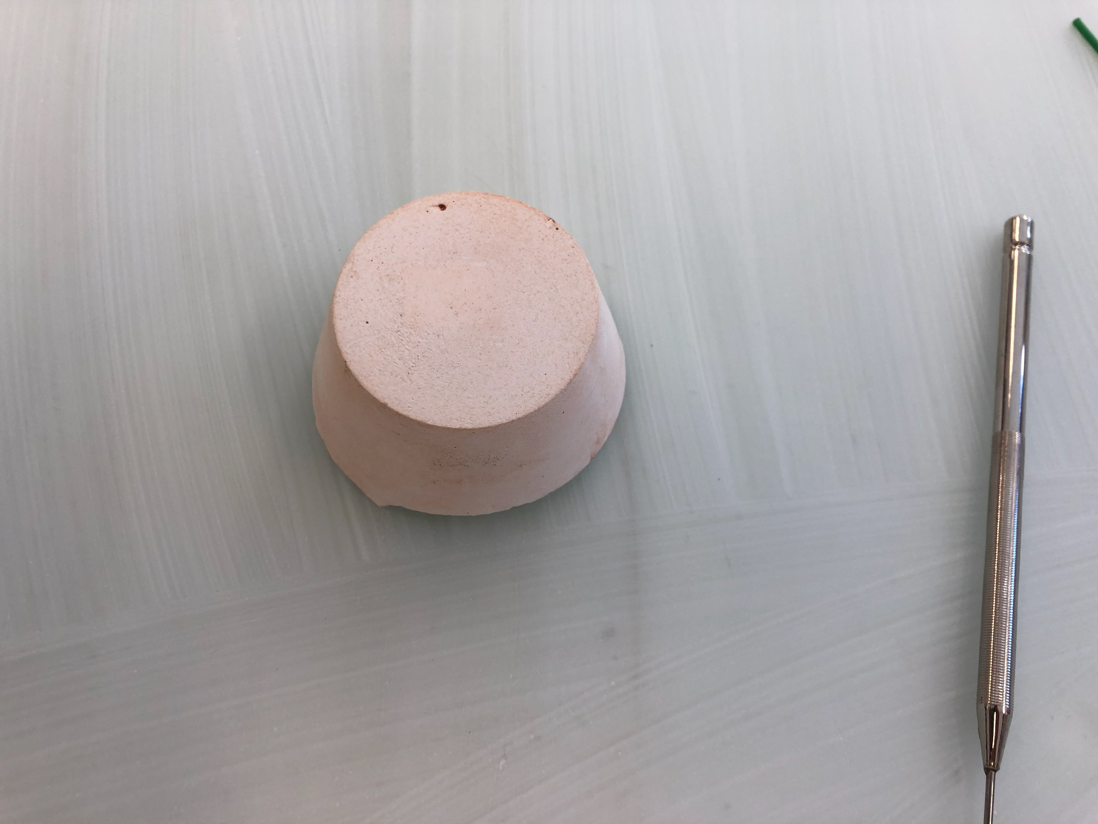 The plain plaster with the sharp tool.