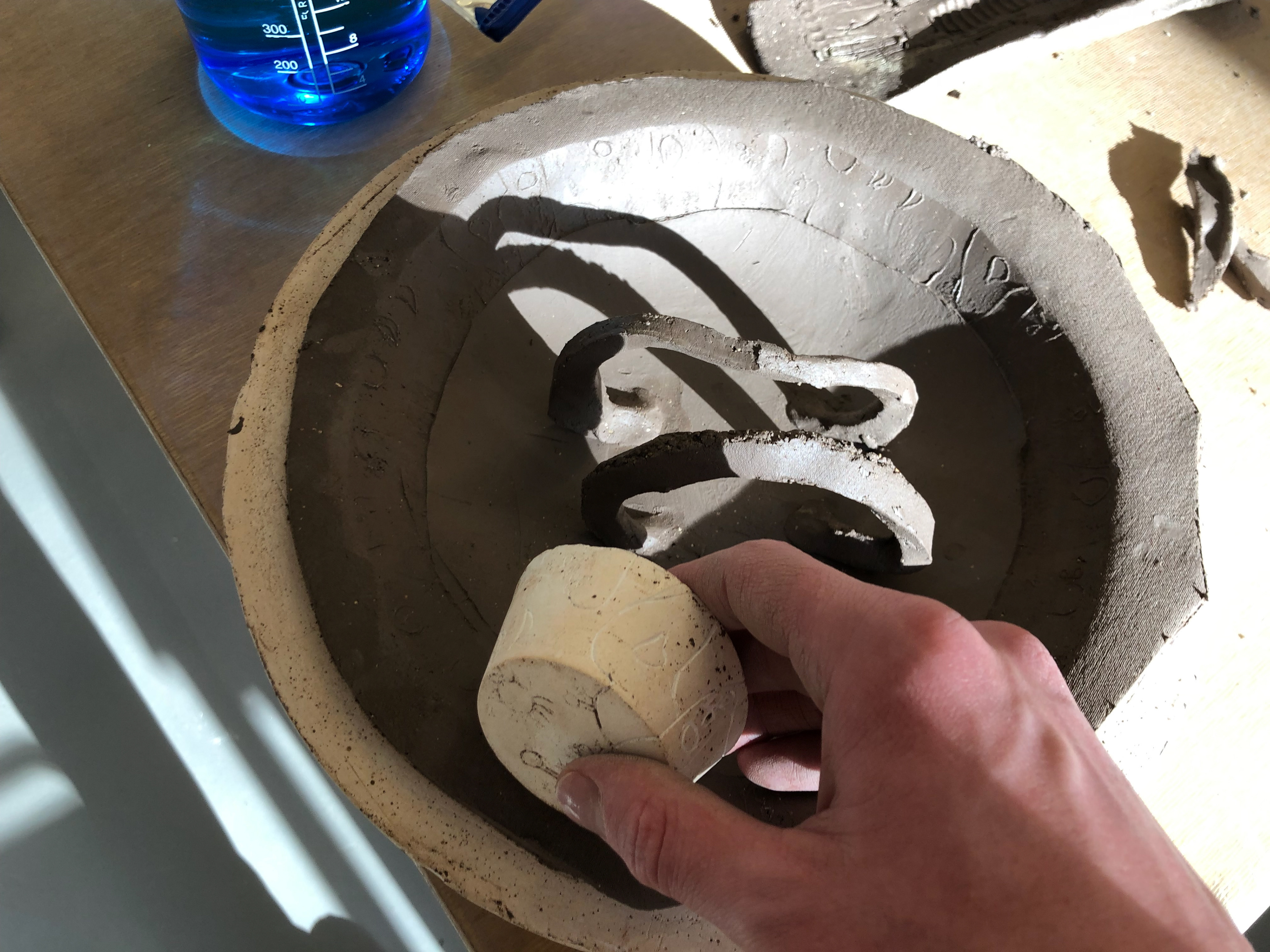 I used the intaglio to imprint my design around the brim of the bowl.