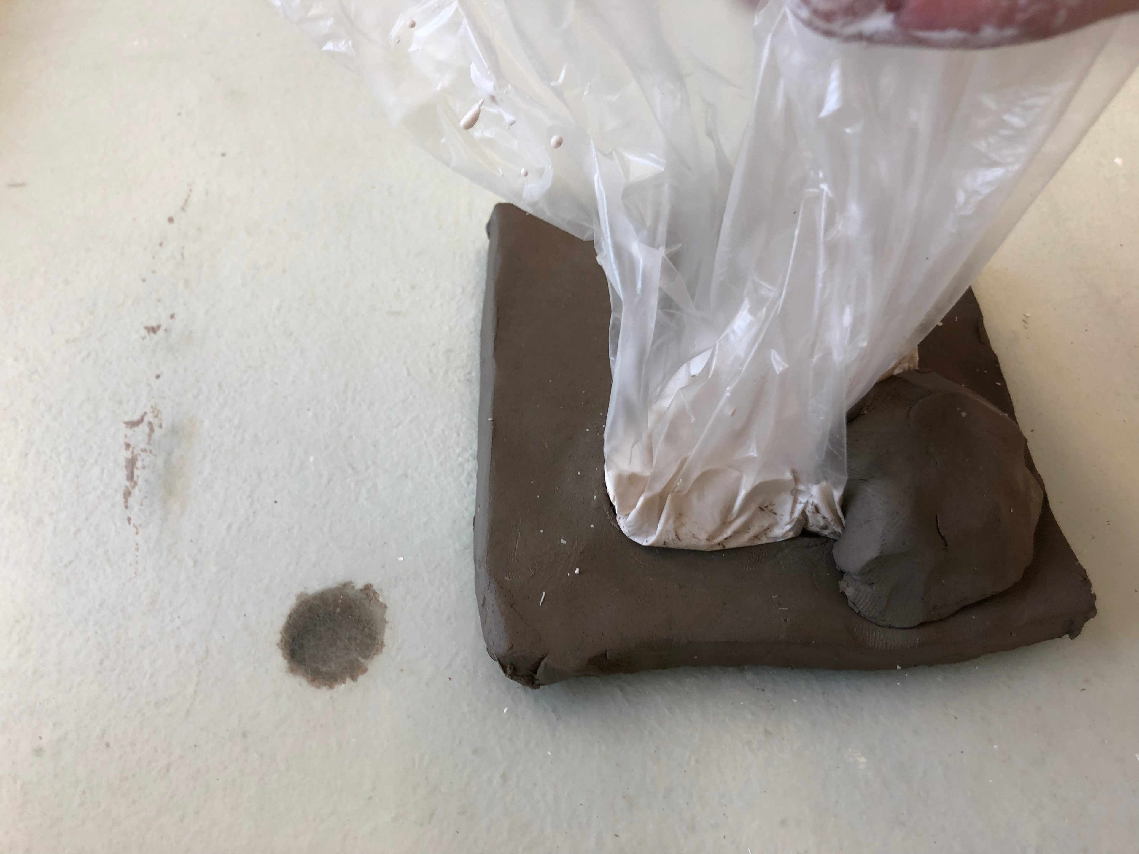 Used the plastic to get the plaster to fold and hit the curved edge.